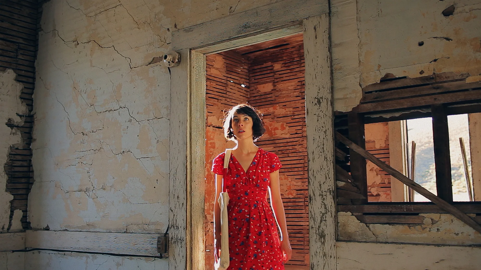 Alice (Zoey Taylor) explores an abandoned old homestead. The Magic Hours - a film by Zoey Taylor and David Connelly