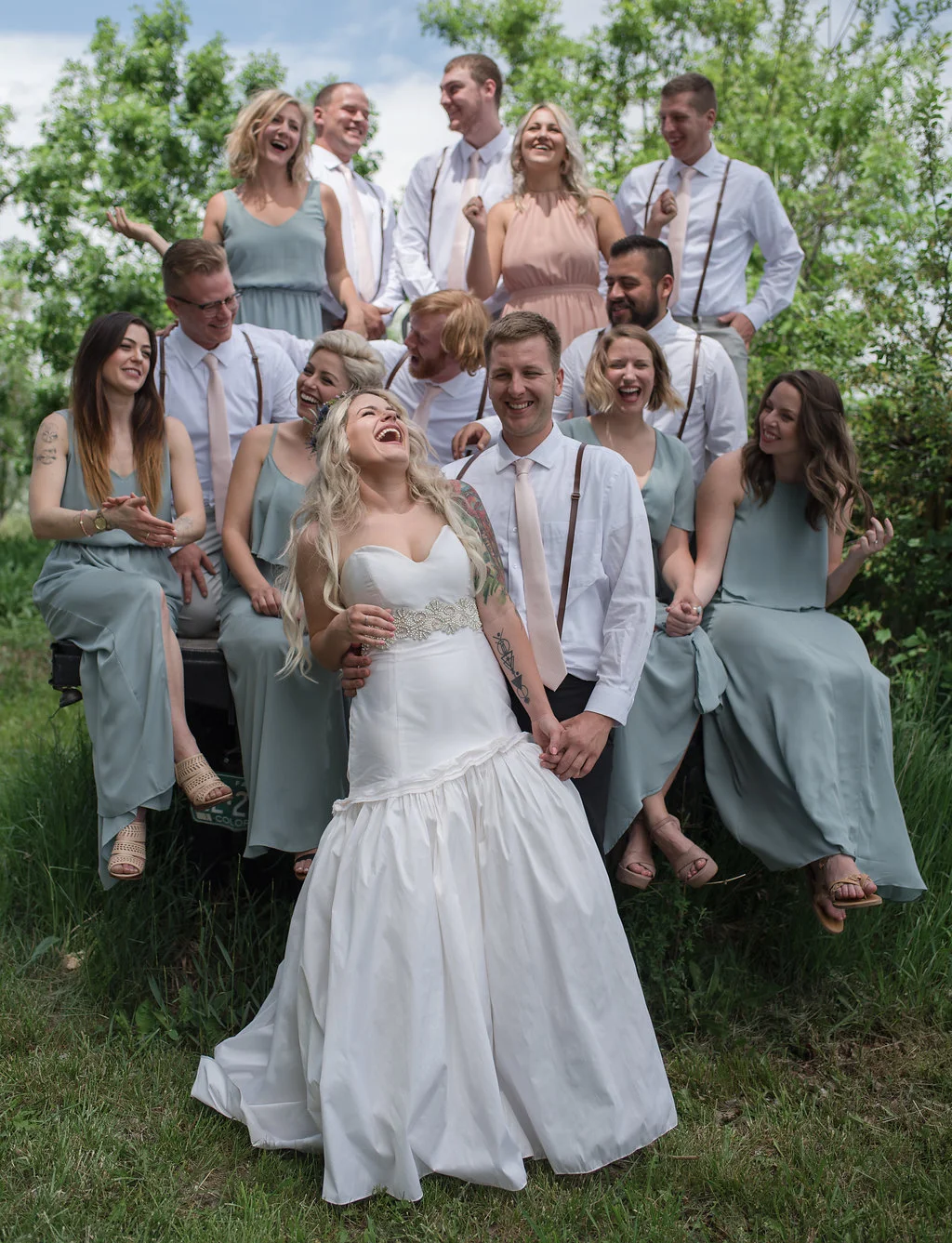  The wedding party gets ready to head to the reception, loaded into the back of a pickup truck!  Colorado wedding planning  Colorado weddings  Outdoor weddings  Rustic  Farm Wedding 