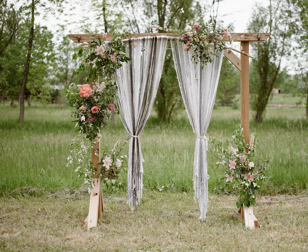  Wedding Ceremony inspiration, a beautiful floral arrangement on the marriage arch. The bride made the intricate yarn decoration, and we used it for both the ceremony and at the reception head table 