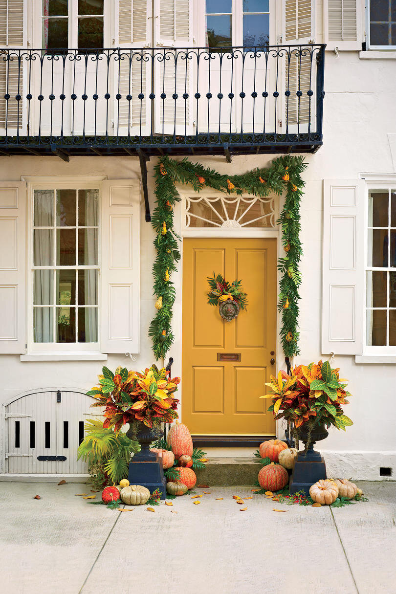 Technically a little closer to a swag than a wreath, but this colorful stoop vignette it certainly hypes the Autumn in a locale that’s probably at least as hot as it is here! The colorful crotons, which wouldn’t keep for very long in the Fall outside the Deep South, are perfect for this Low Country home. Also, the yellow door? YES. …Photo via Southern Living by Heather Barrie. Photo by Helen Norman.