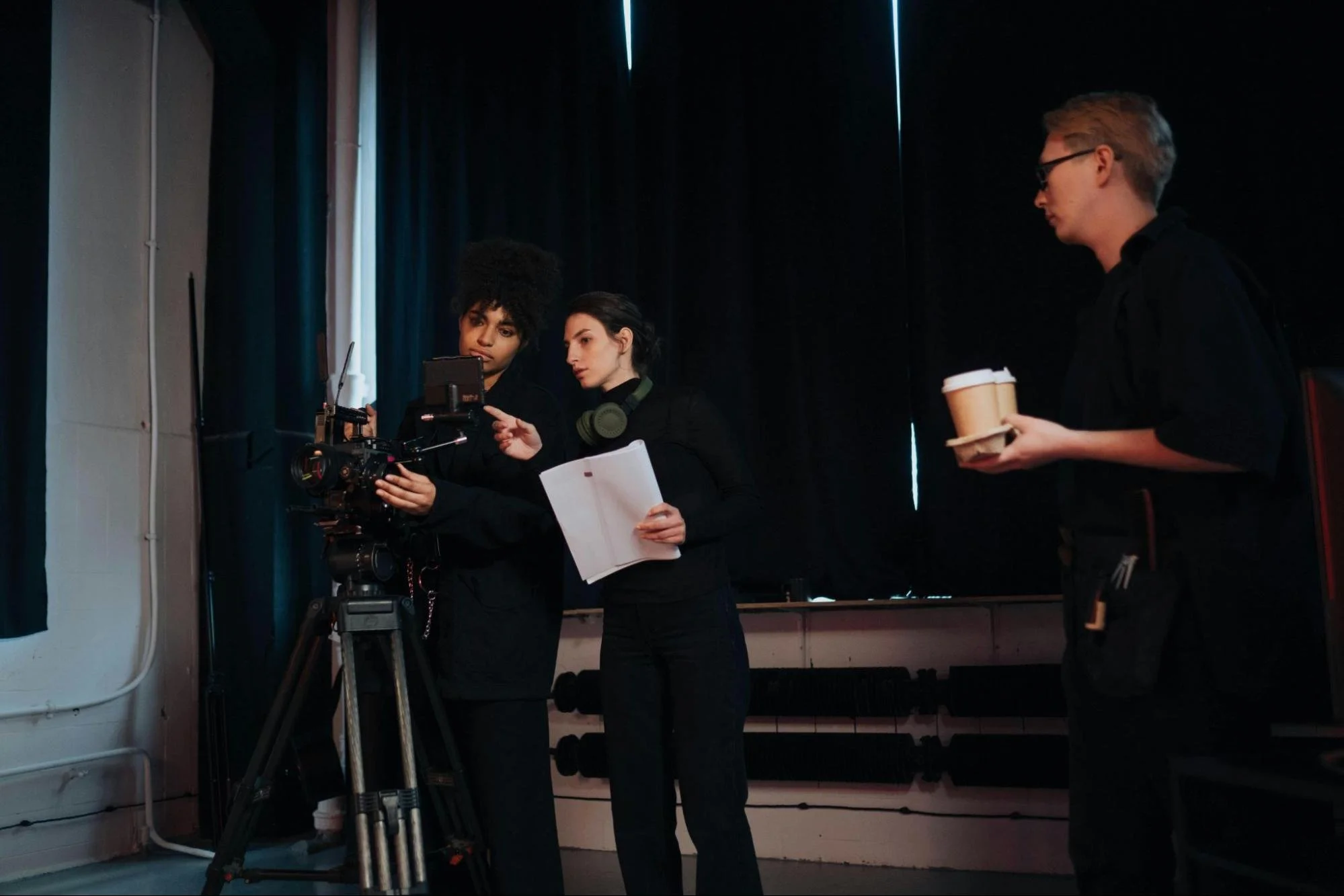 Director educating the videographer of the shot