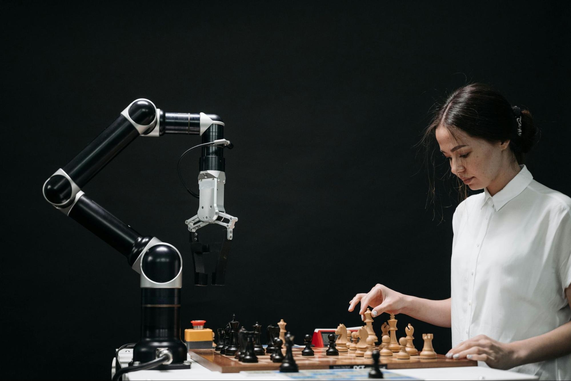 Robot playing chess with a human