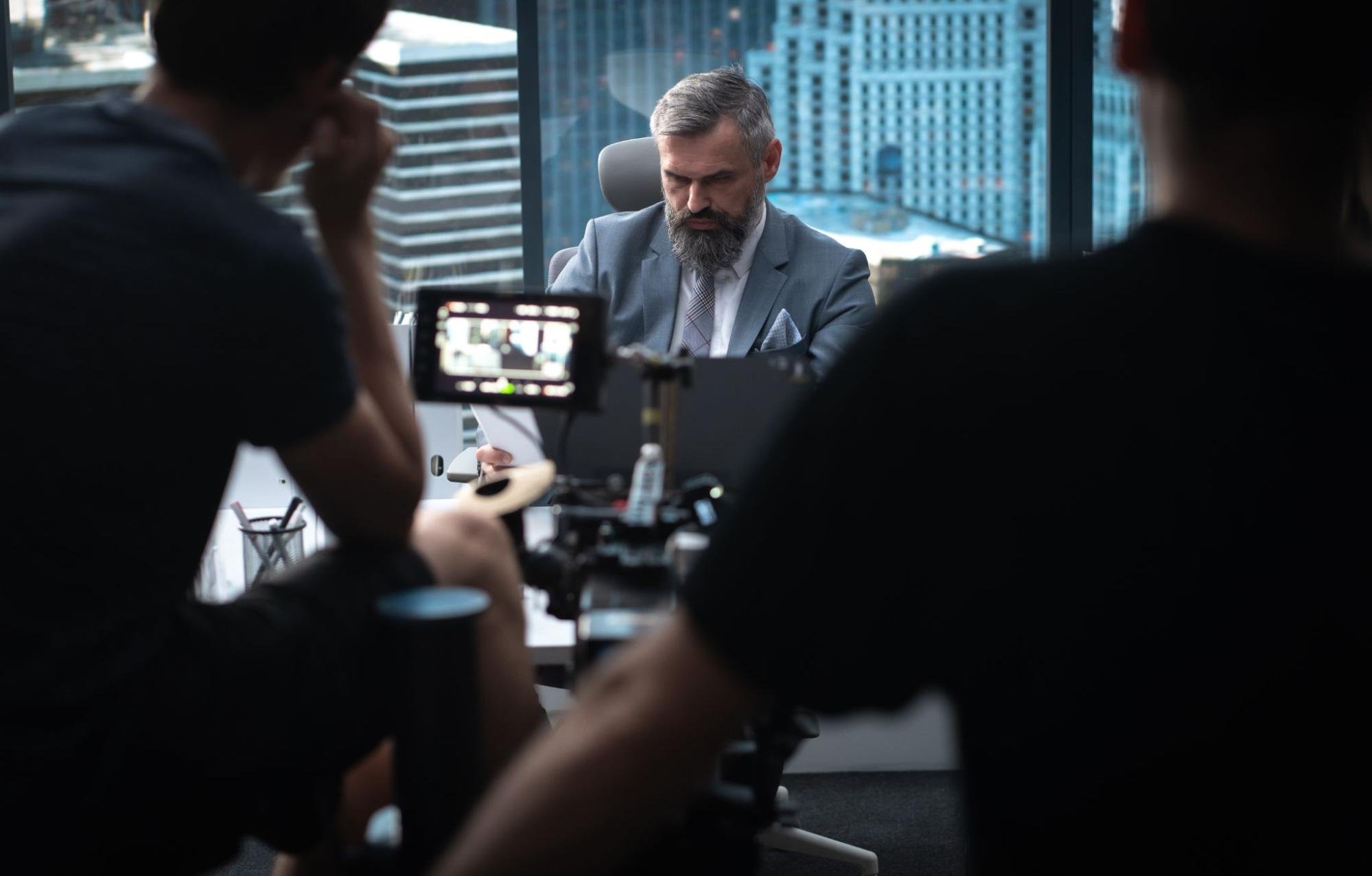 A man being filmed working