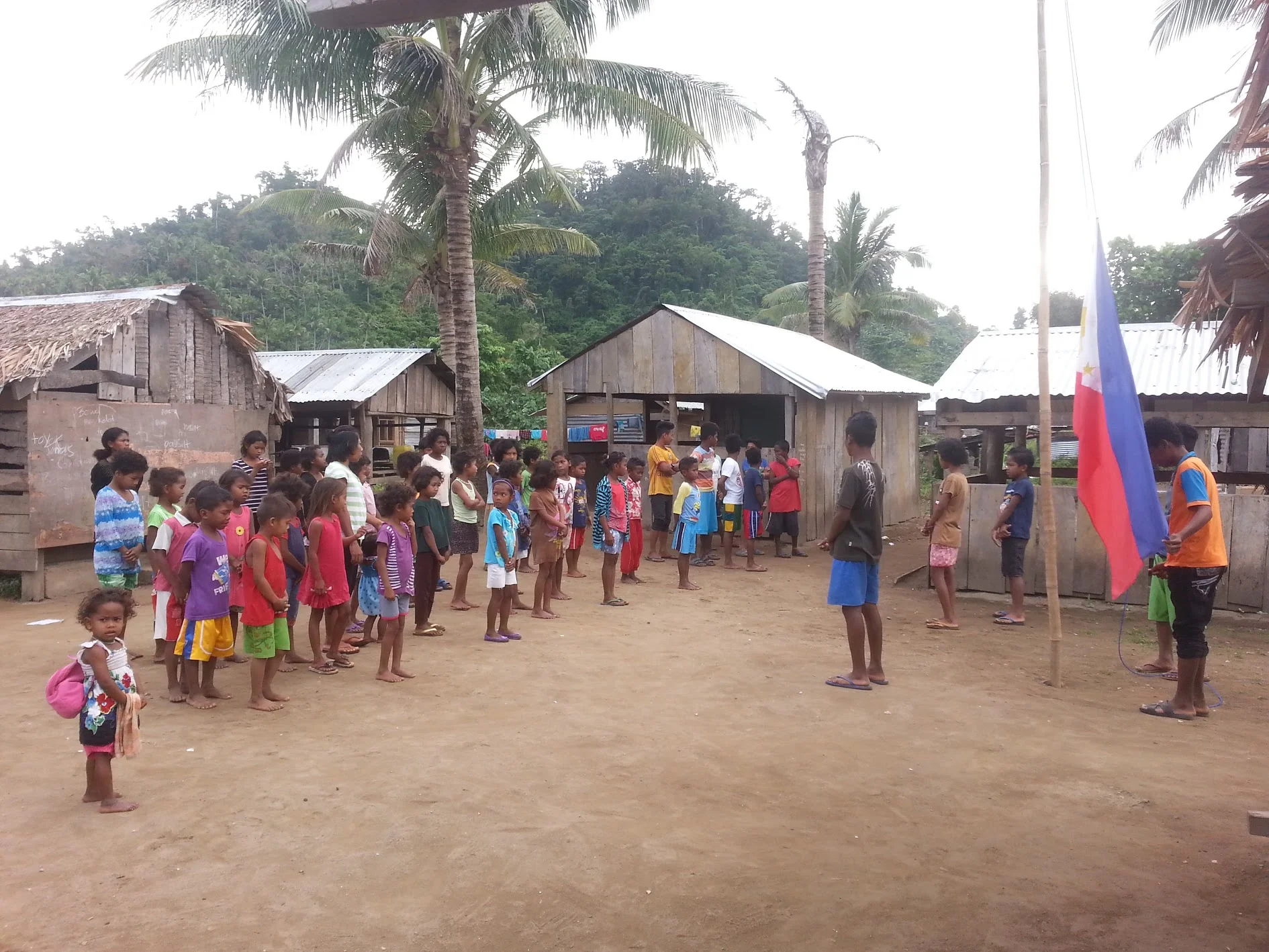 The elementary school in Dipontian Village has about 65 kids, from 1st through sixth grade. Here, the students and teachers are getting ready for the morning flag raising.