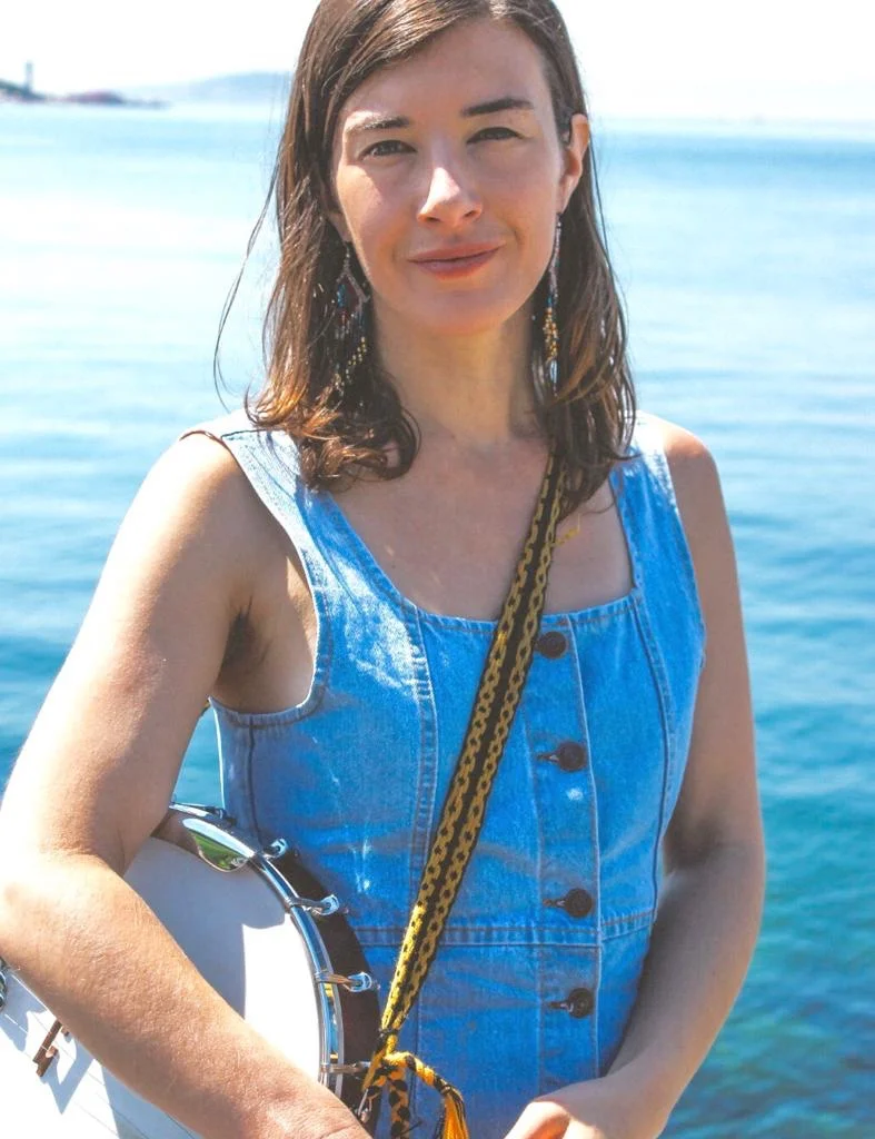 Kasia Kugay Chicken Mama is the stage name for Istanbul-based singer-songwriter Kasia Kugay, whose brief time tending chickens made a permanent mark on her soul and music. A native of San Francisco, California with Polish and Turkish parents, Kugay blends her musical heritage with American roots music. Her time traveling in Turkey and the Balkans have made their impressions and continue to be a theme for exploration. The resultant folk is “unique and intricately crafted, well-suited to Kugay’s deeply emotive voice” (Good Times), which ranges from clear and bright to dark and sultry. Using the guitar as her primary accompaniment for the bulk of her career, Kugay picked up the banjo in 2016 and began learning clawhammer technique for traditional Appalachian tunes and her original songs, and more recently traditional music from the Eastern Black Sea region of Turkey. Her study of vocal improvisation has influenced intentional departures from form while her lyrics concern the land and the creatures she has walked it with. Chicken Mama released her self-titled debut album in summer 2017, featuring many of the talented musicians in her community of Santa Cruz, California. She currently resides in Istanbul, Turkey, where she is deepening her understanding of traditional Anatolian music, learning the Turkish language and collaborating with her musical peers.