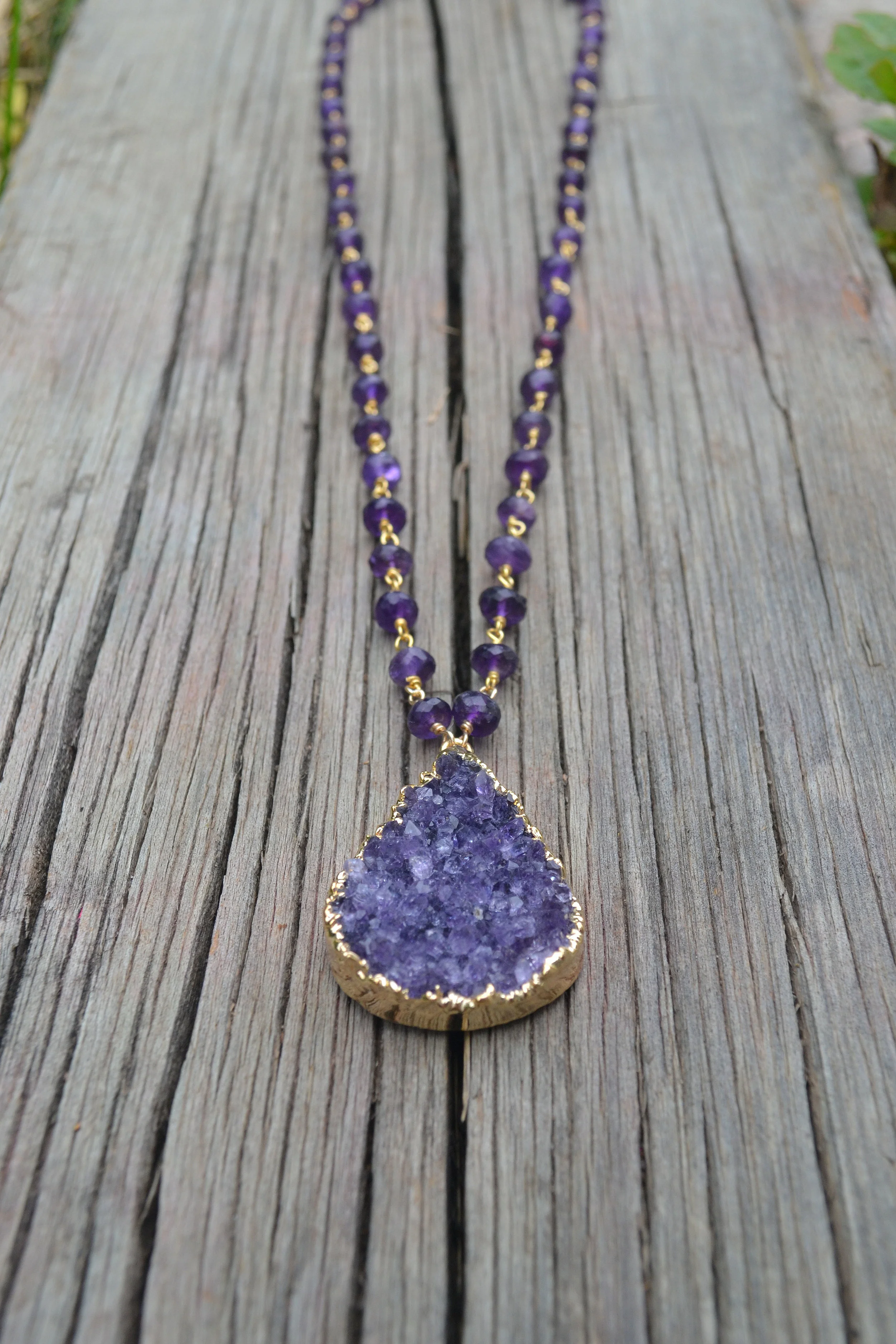 amethyst bezel neck at angle on wood.jpg