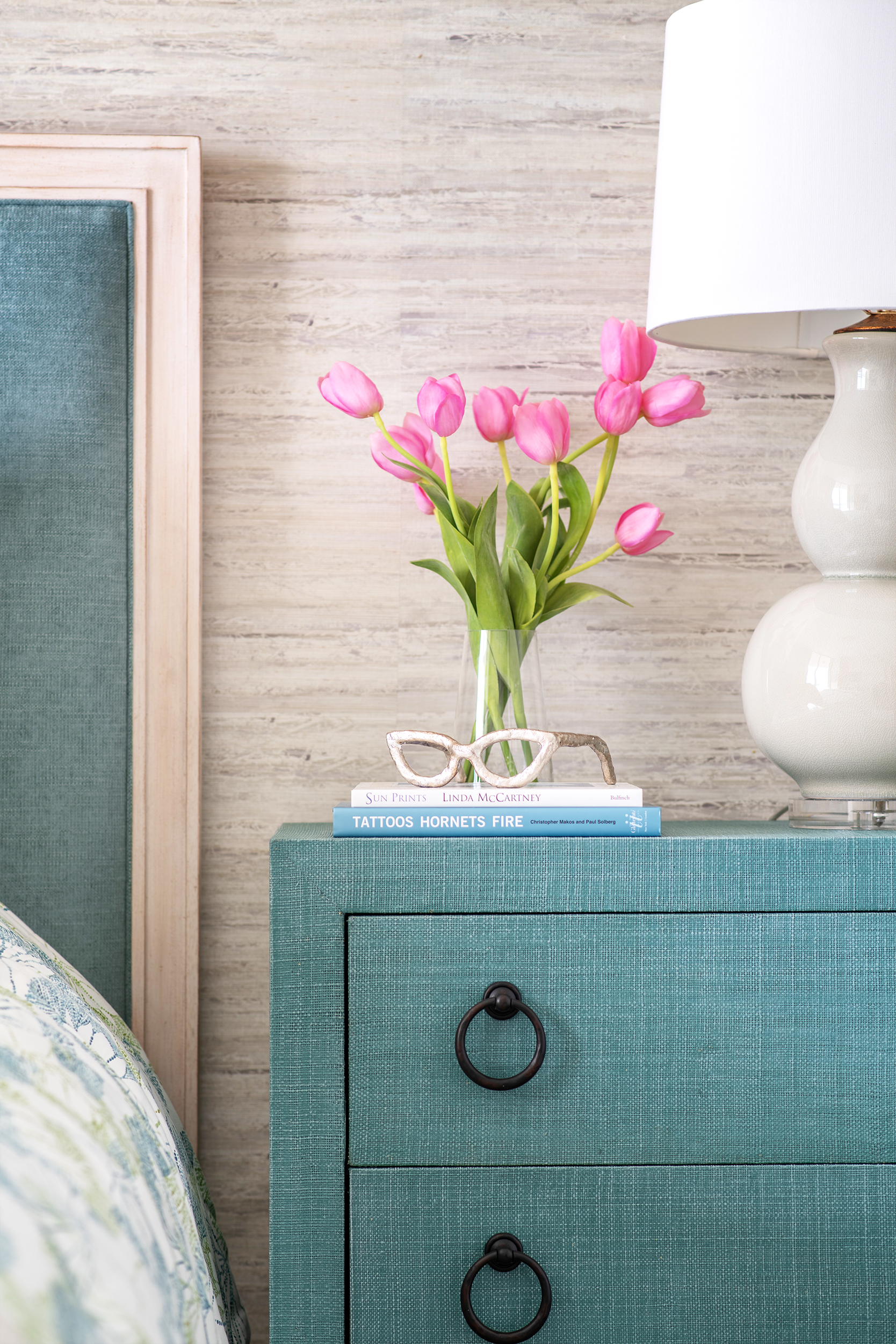 coastal bedroom with turquoise nightstand