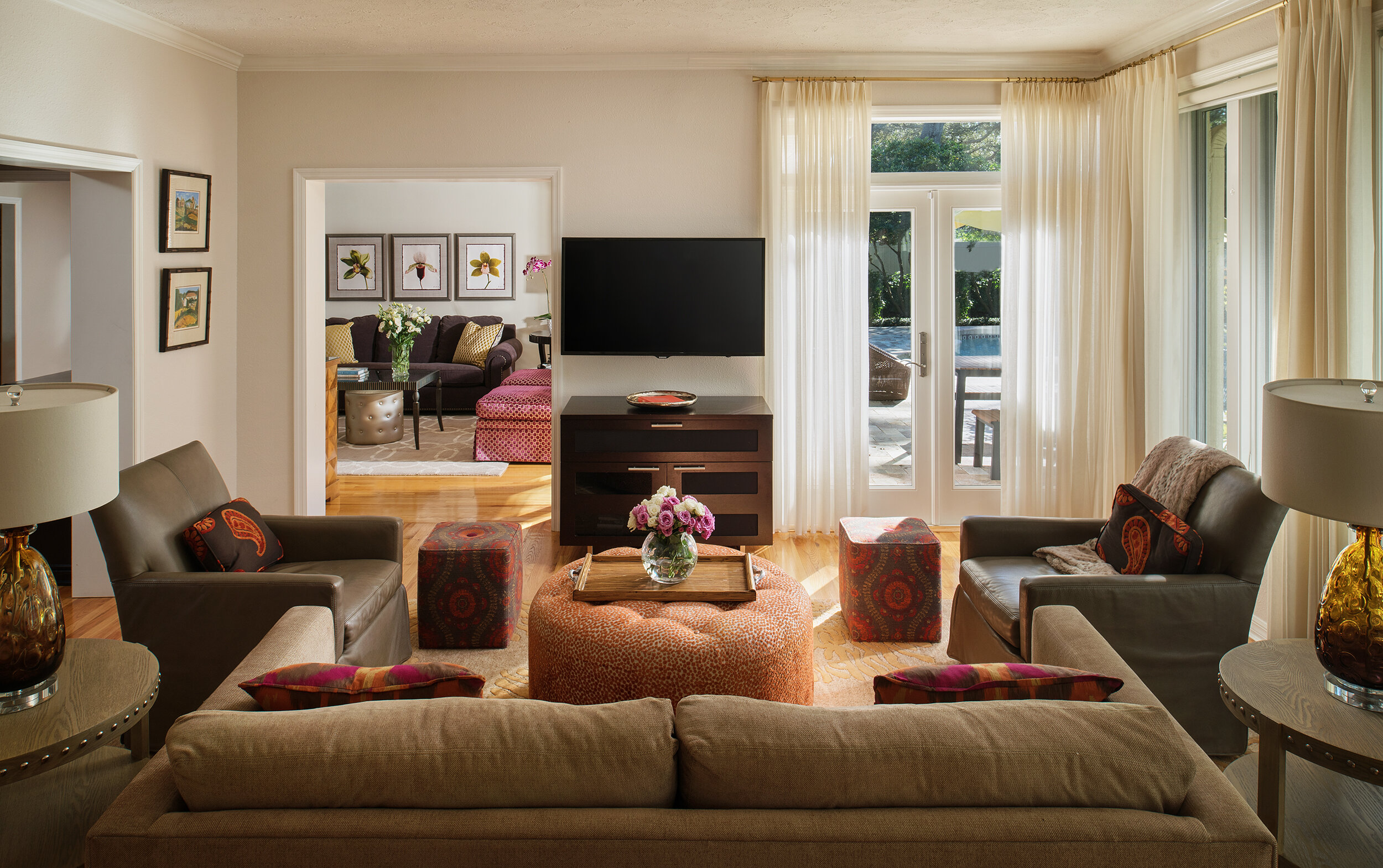 Brown orange and warm tones living room couches and wood