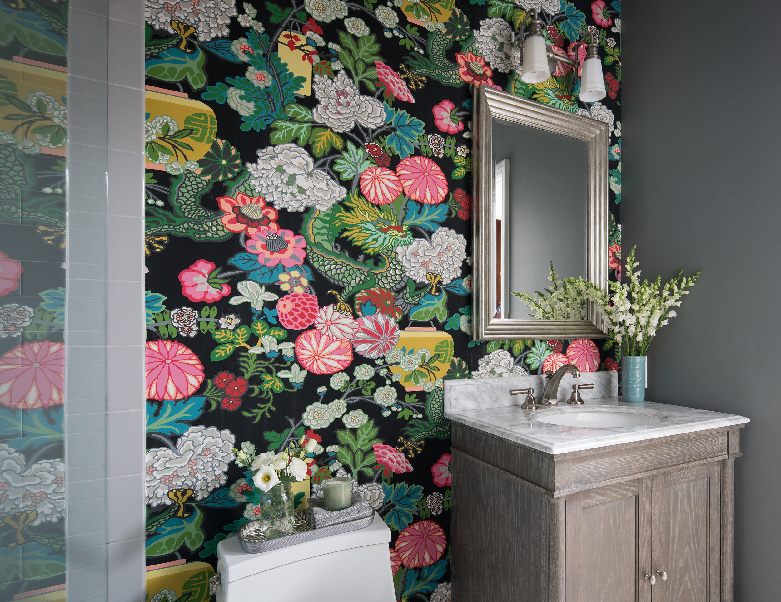 bold floral print wallpaper bathroom with marble sink