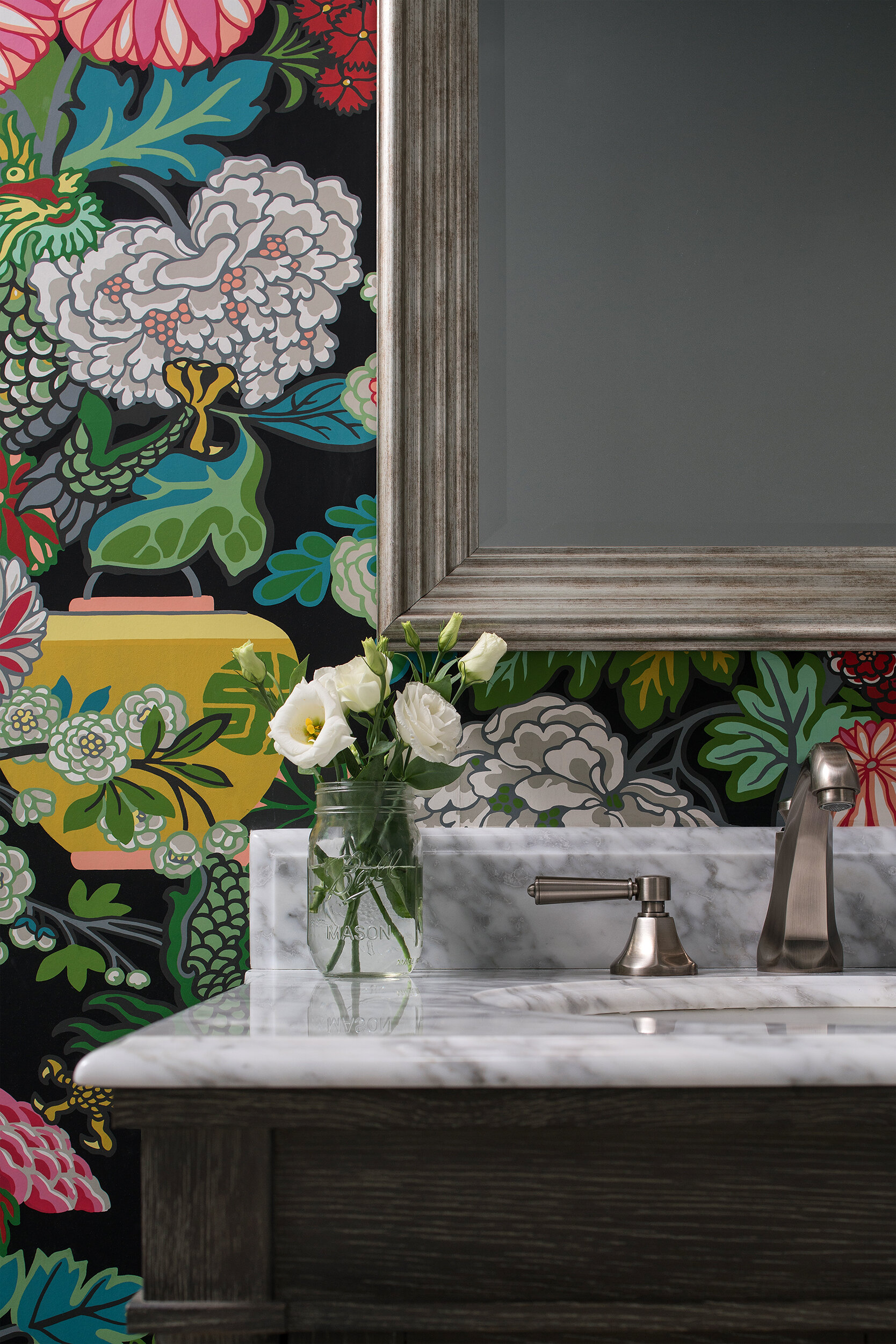 bold floral print wallpaper bathroom with marble sink