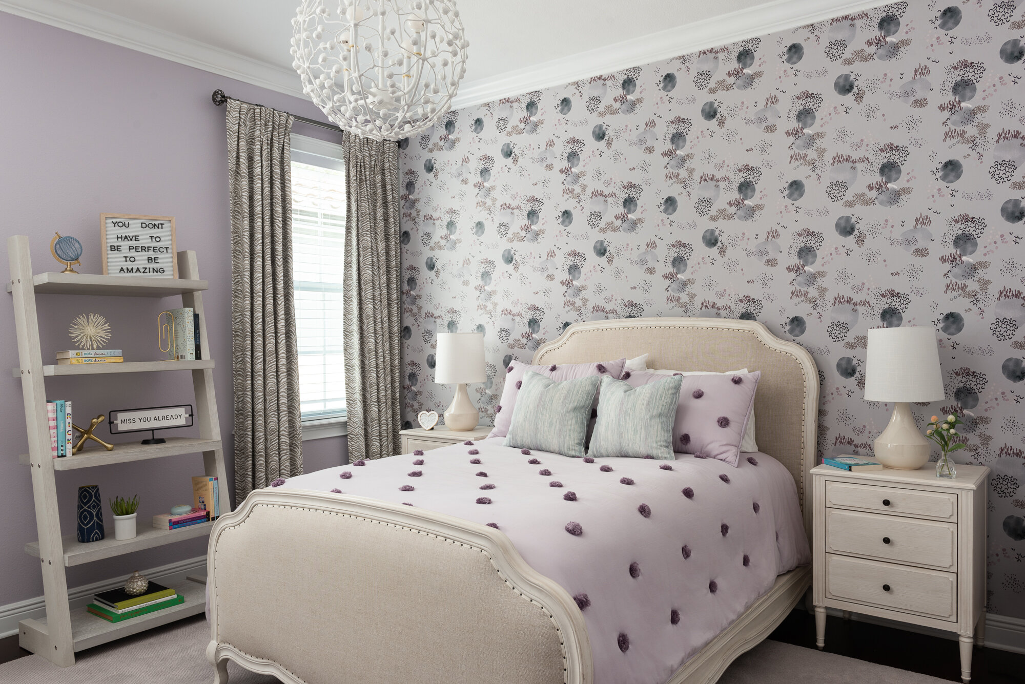 bedroom purple floral wallpaper with white bedside table and comforter