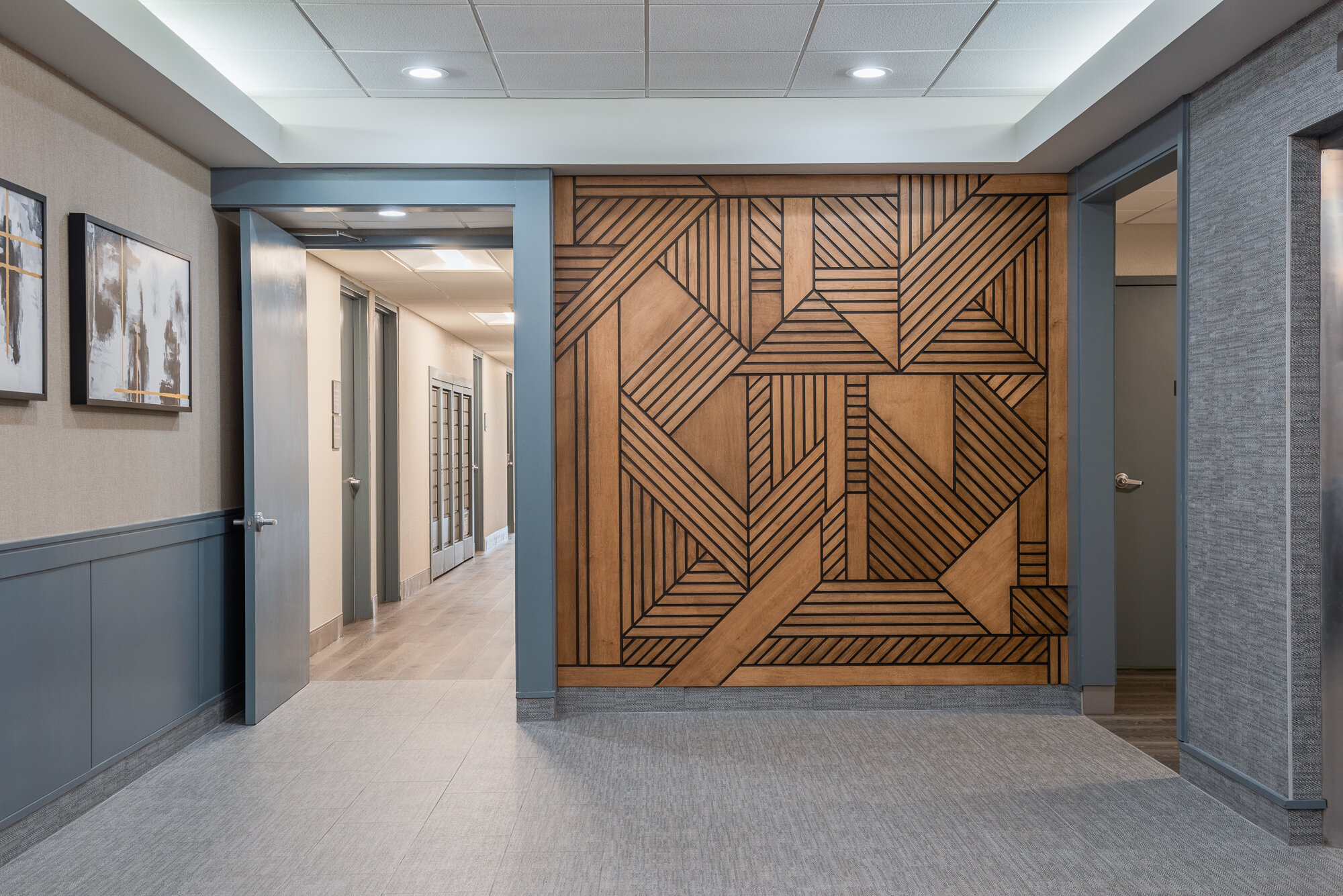 Wood geometric accent wall lobby