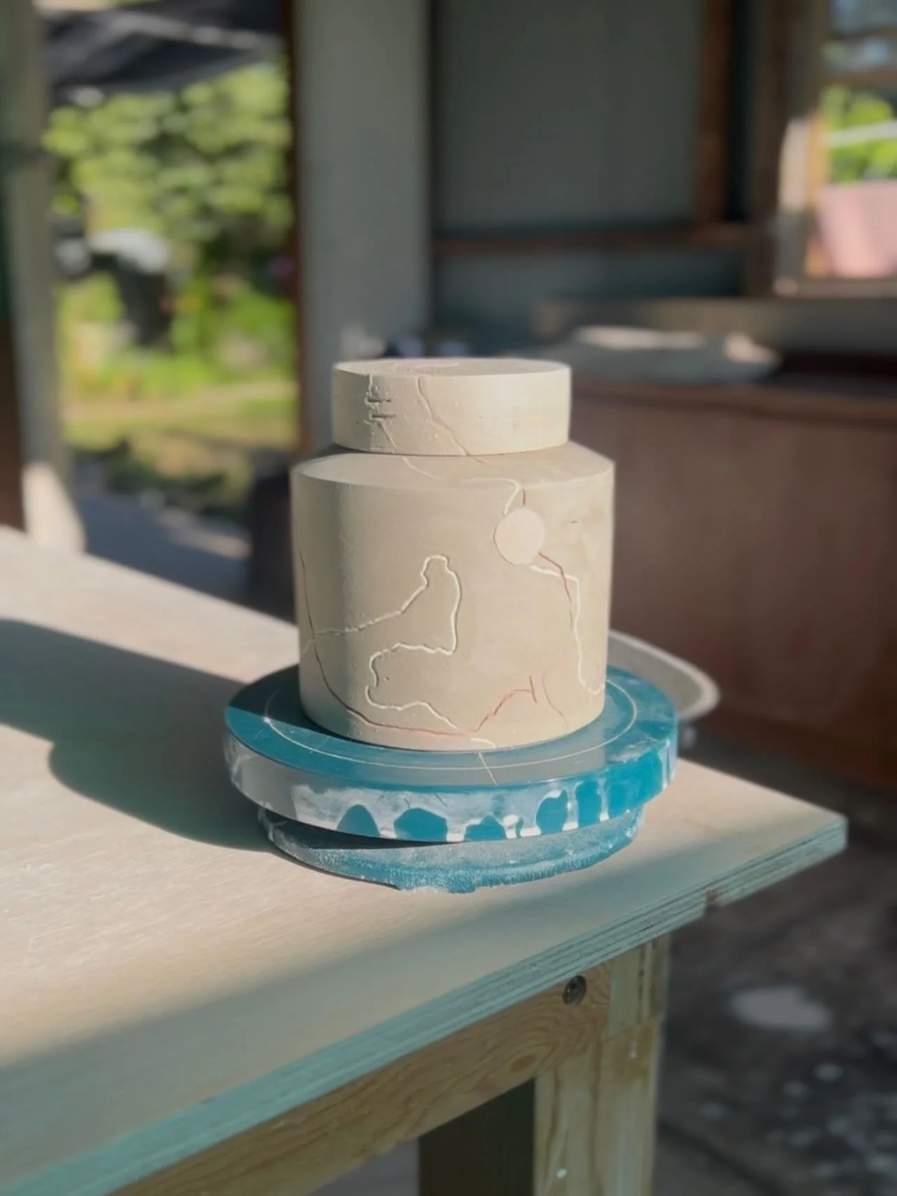 A sunny Monday eve in the studio 🌞

I drew this pot on Friday.
Threw the blank form at the wheel Saturday. 
Trimmed it Sunday morning. 
And then today (Monday) sketched out lines and inlaid colour into them. 

There&rsquo;s some tweaks to be made on