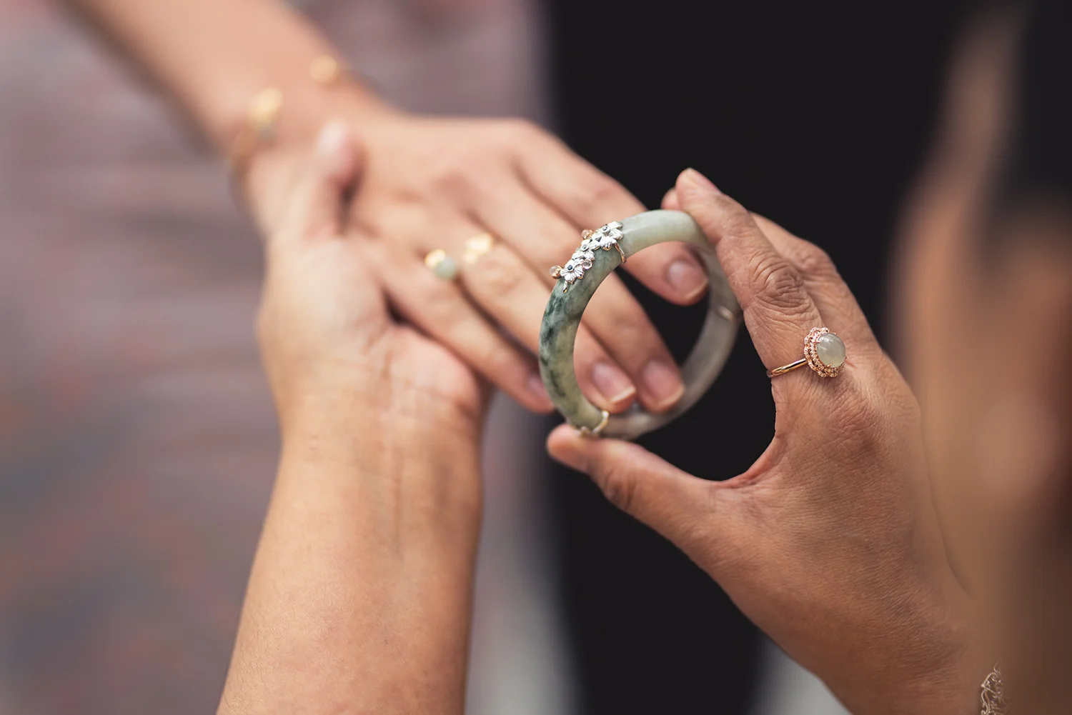 The bride receives a Sakura Jade Bangle, a precious keepsake of this momentous occasion.