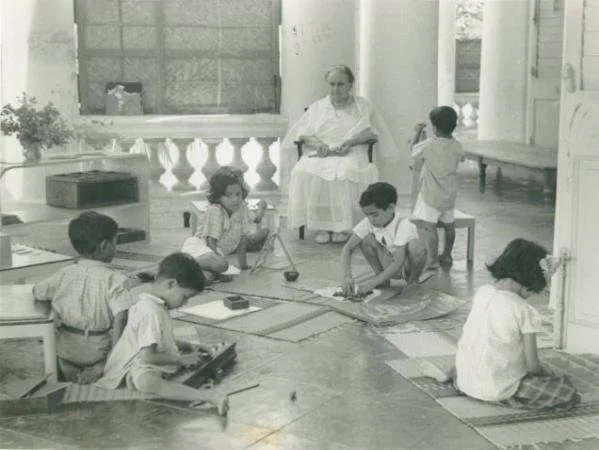 1-Maria-Montessori-with-children-at-Olcotts-bungalow-The-Hindu-2010.png