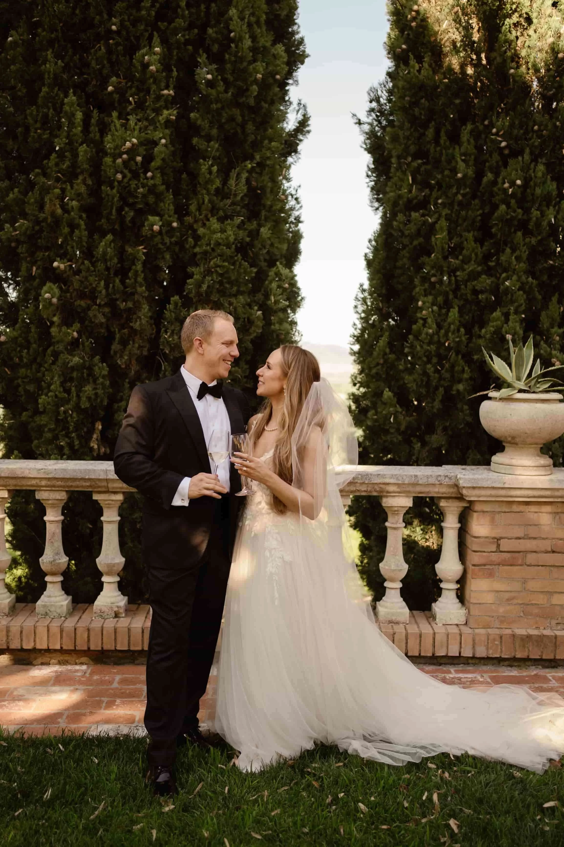 A bride and groom celebrating on their wedding day after they did their first dance with the easiest wedding dance style