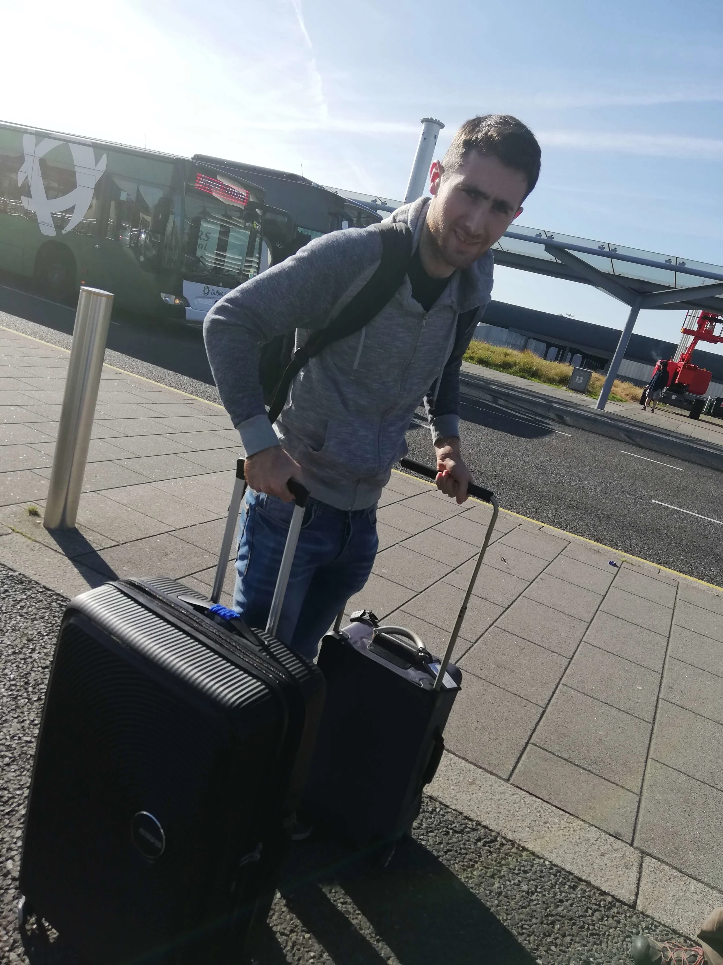 Man with two suitcases at the airport