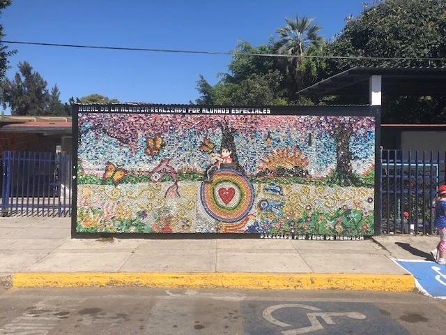 This mural is made up of bottle caps of varying colors!