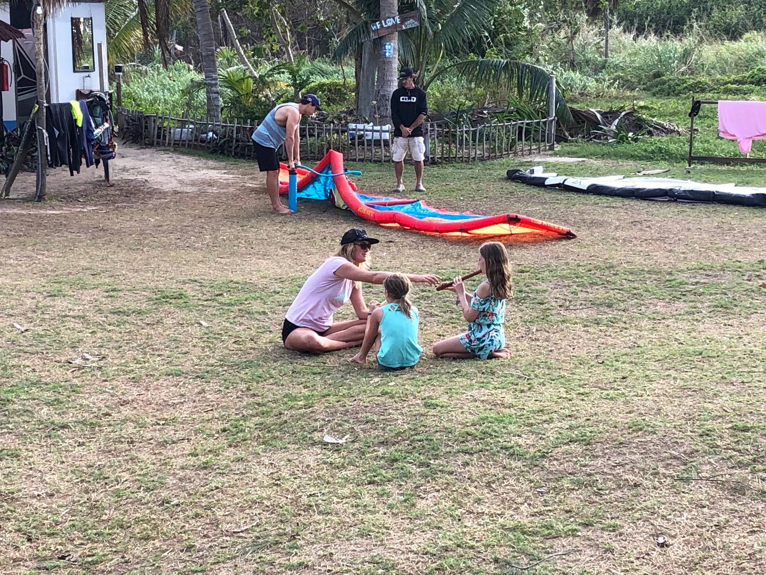 The girls playing the recorder with one of the instructors