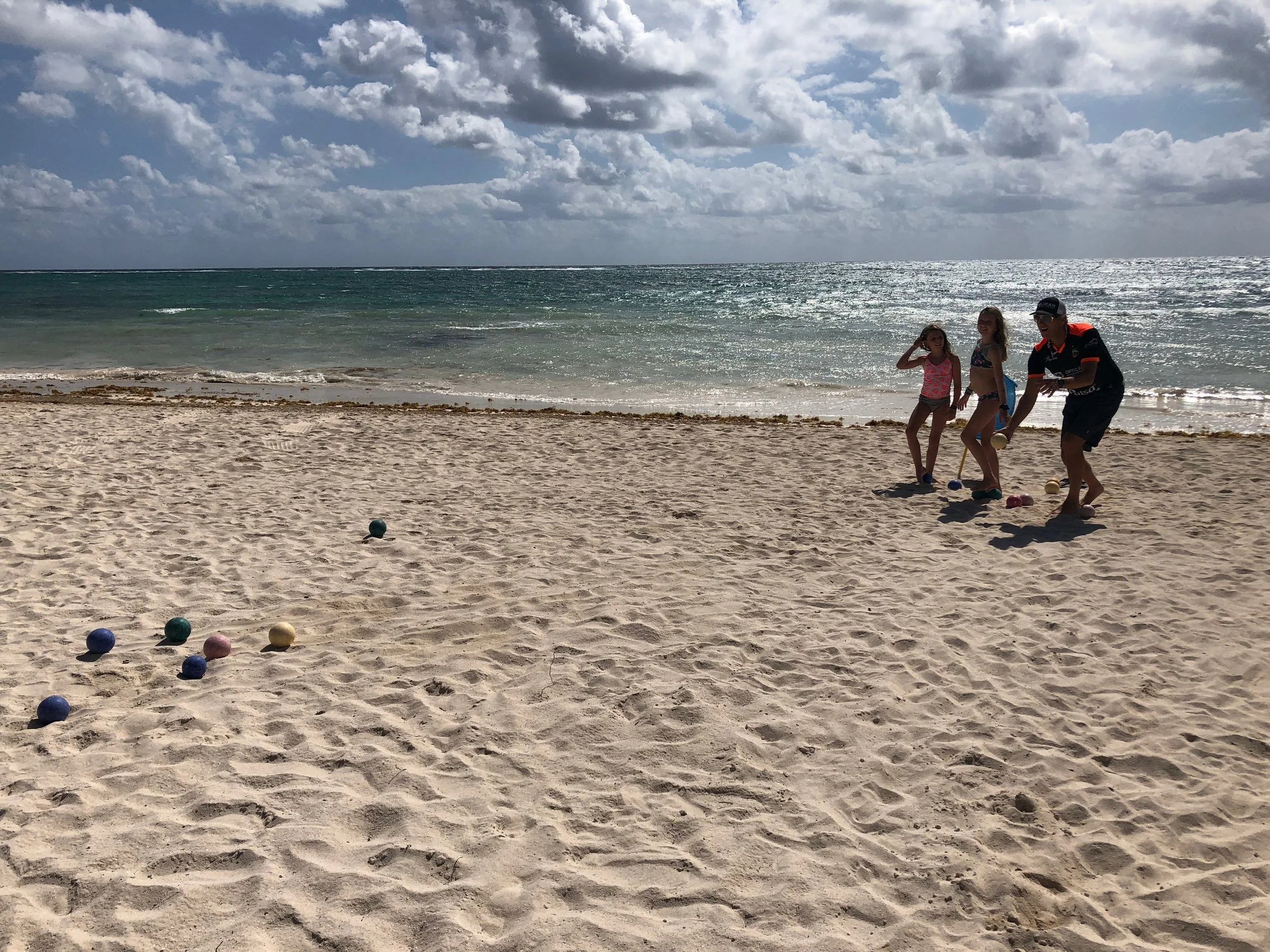 A family game of bocce on the beach