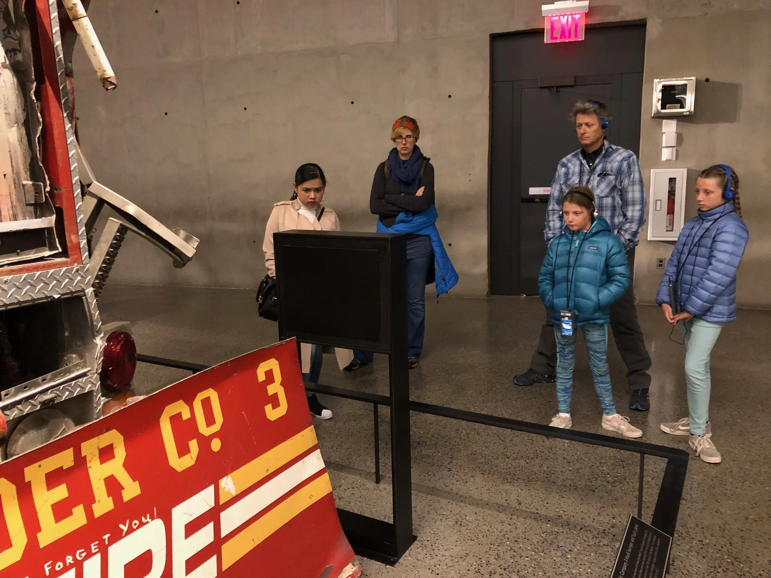 John and the girls listening intently to the audio tour