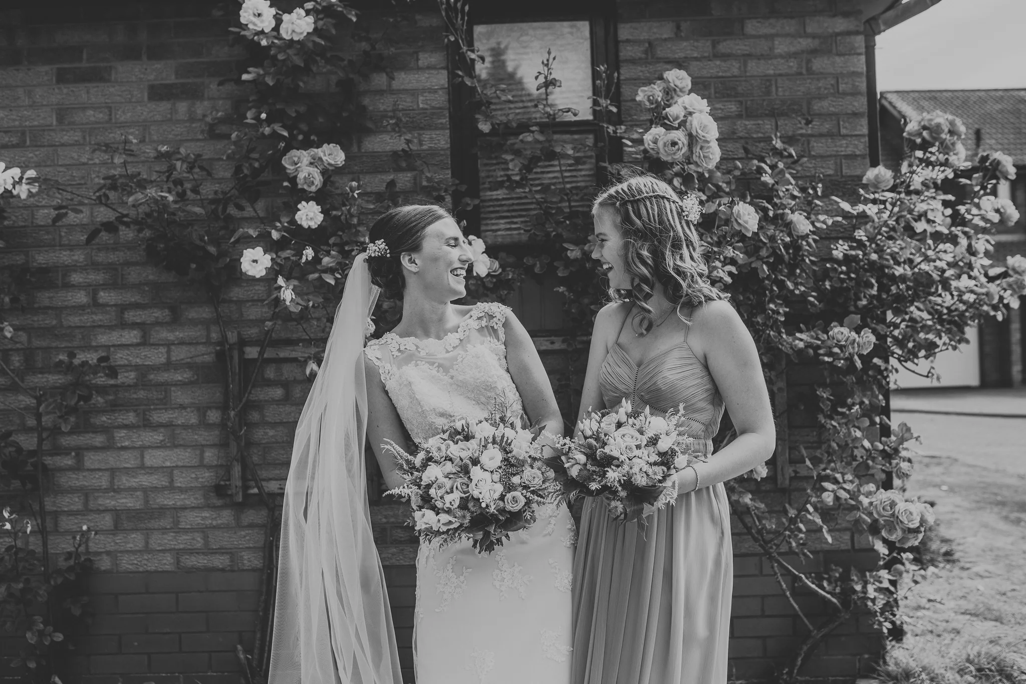 Jess and Ben - Liverpool wedding - two sisters laughing