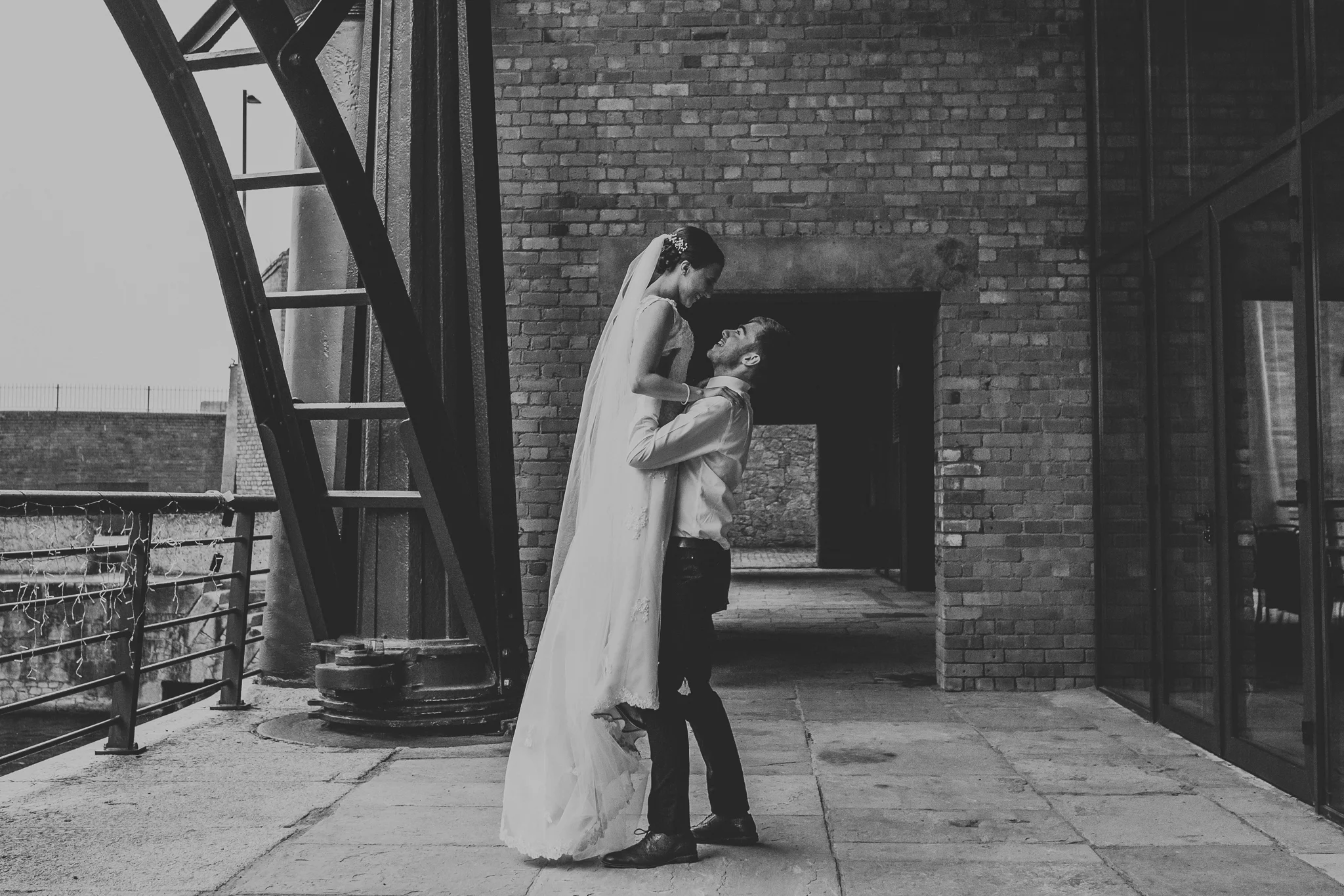 Jess and Ben - Liverpool wedding - groom lifting up the bride
