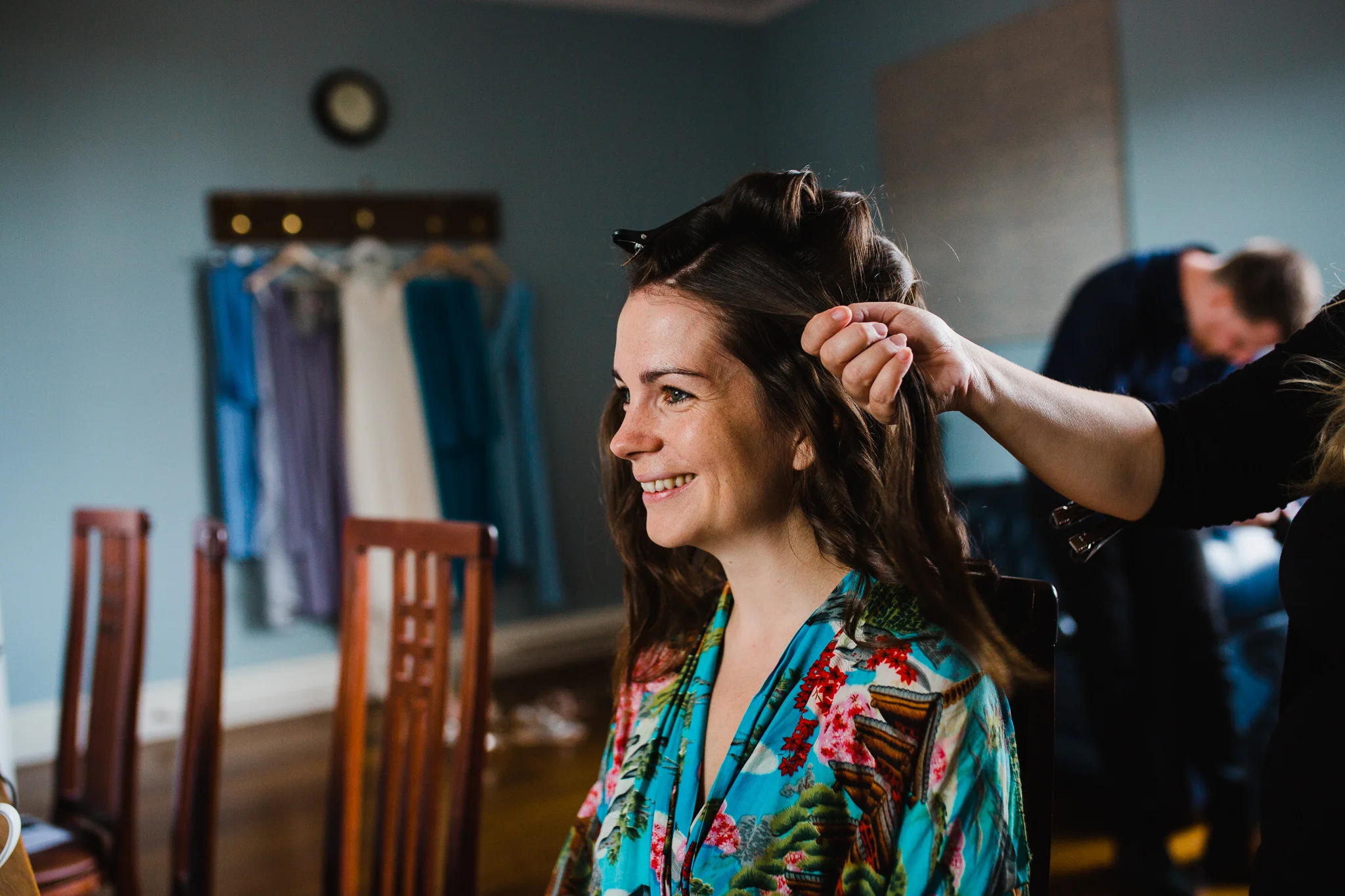 bride smiling having her hair done