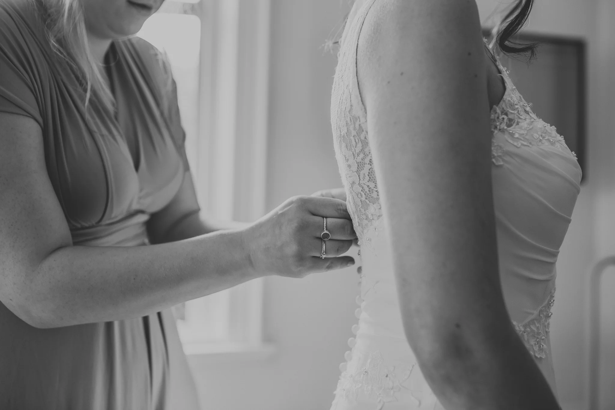 detail shot of buttoning wedding dress
