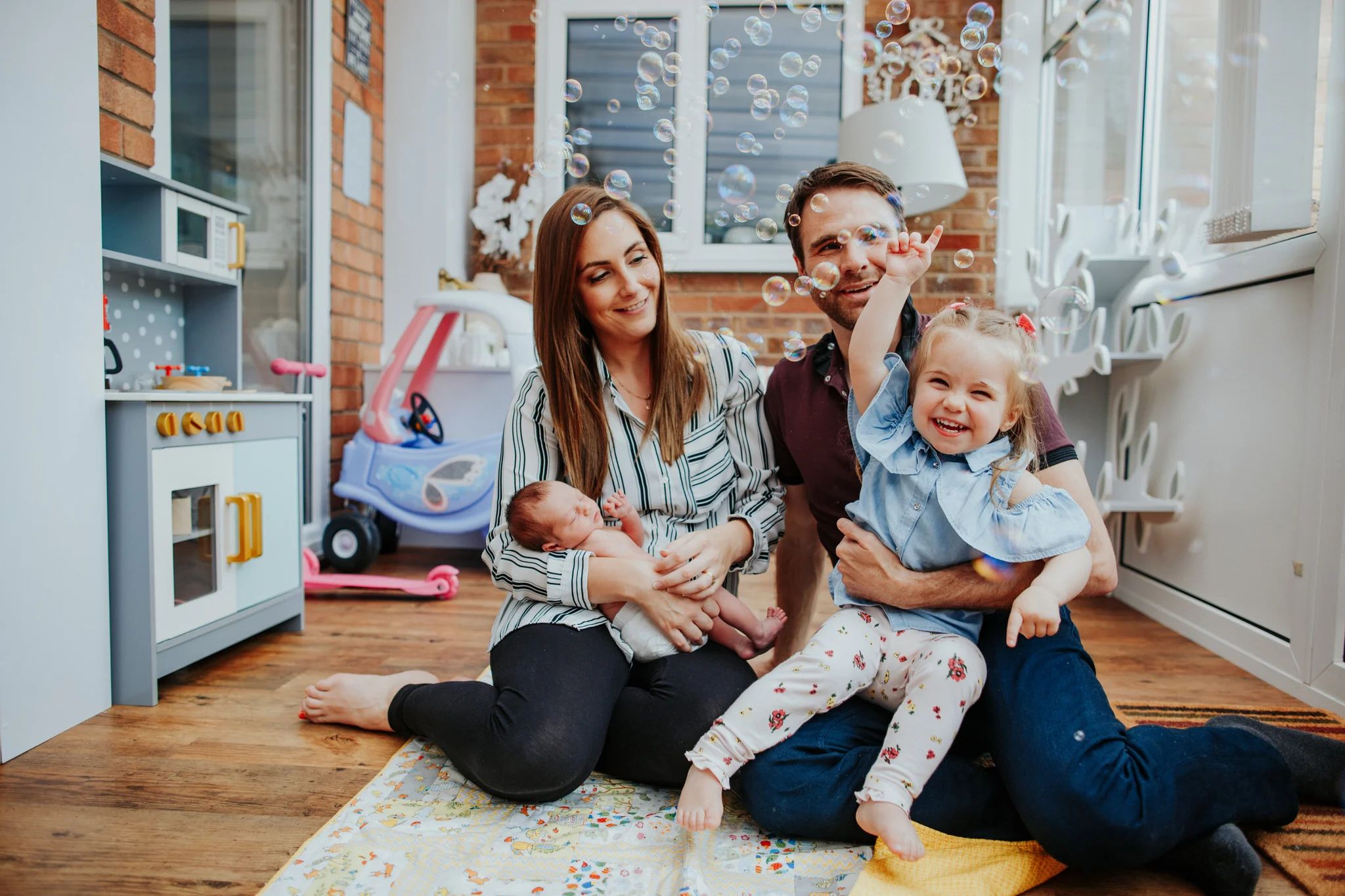 family portrait of new baby siter