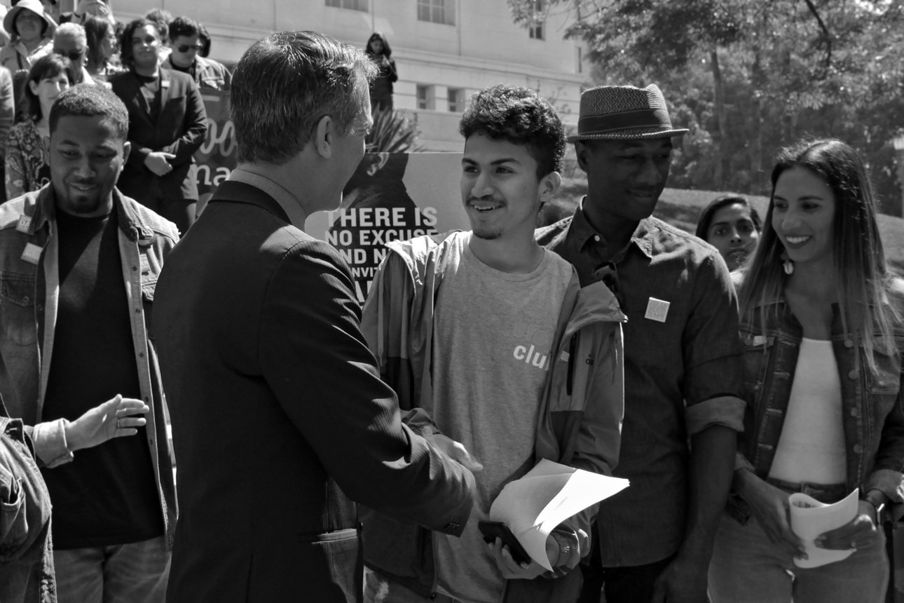  Alexis, Youth Over Violence Leader, shares a moment with Mayor Eric Garcetti.. 