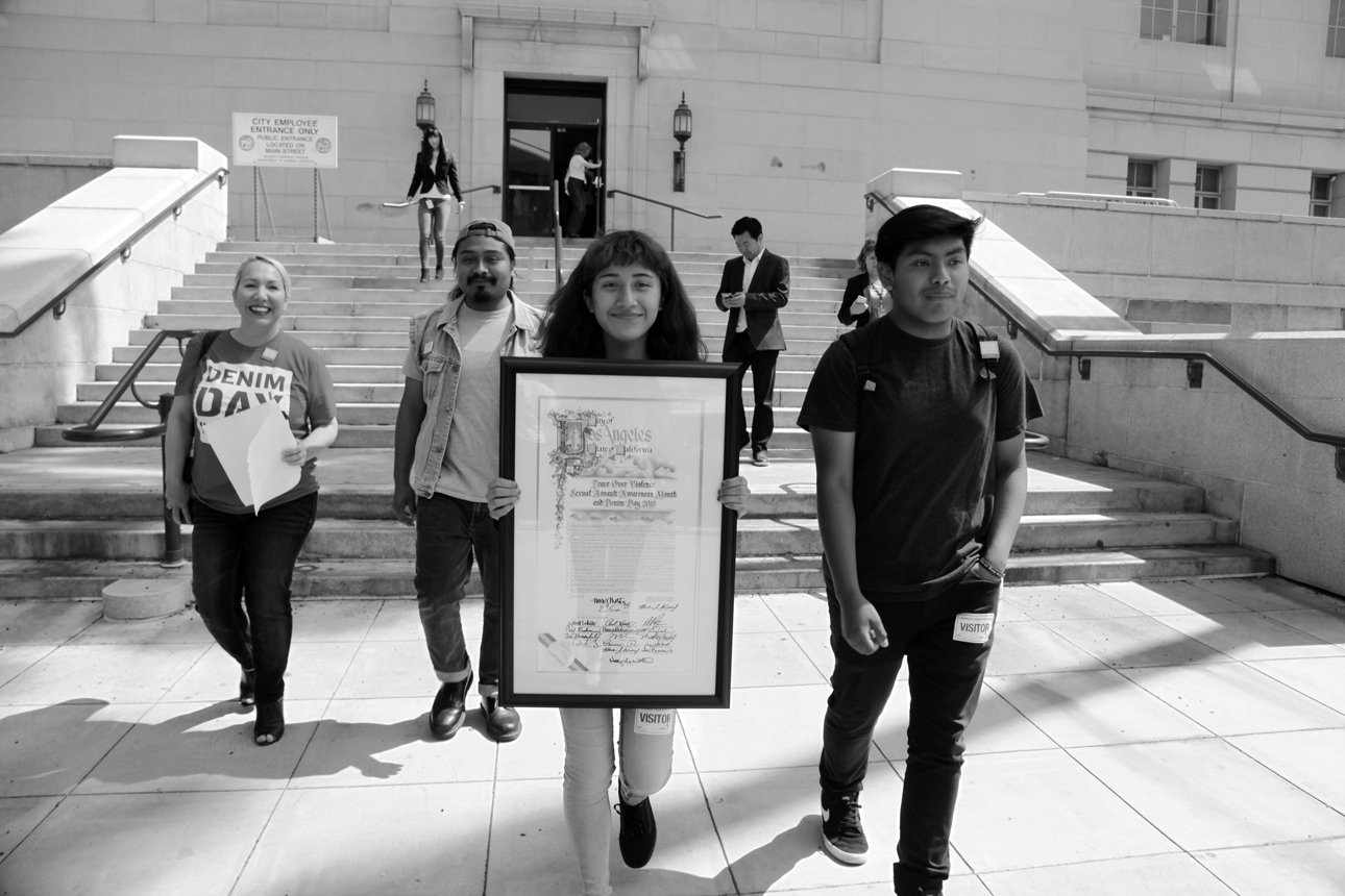  Youth Leaders and POV Staff exit LA City Hall and join the Denim Day Rally and Press Conference. 