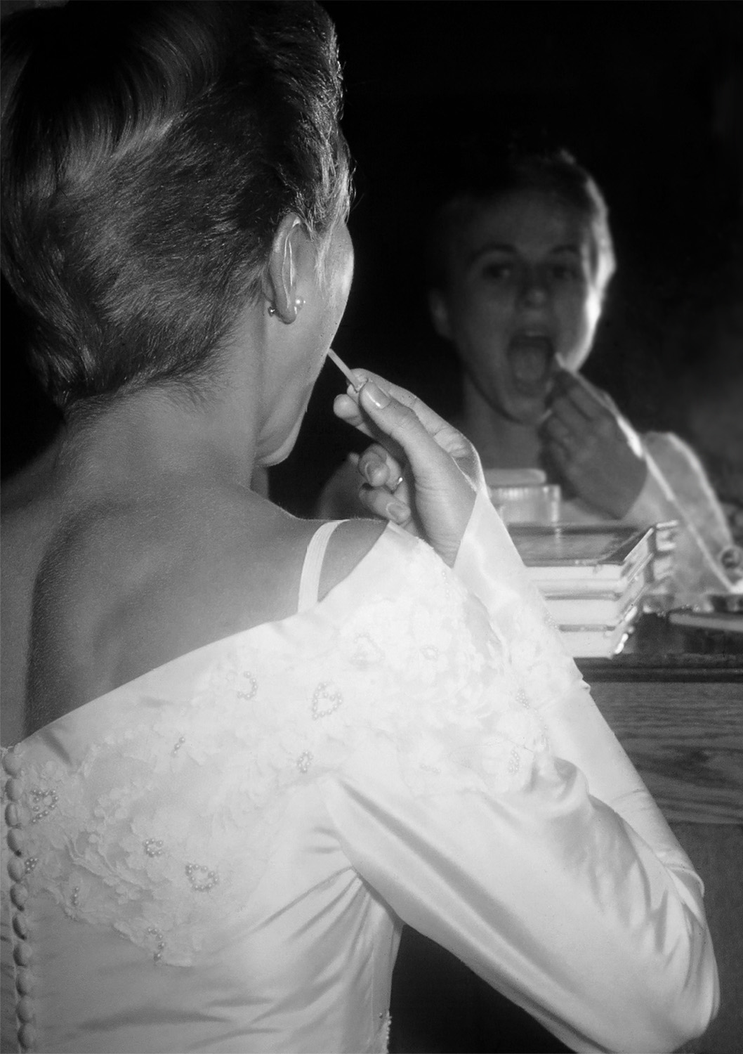 Mom, getting ready to go down the aisle on her wedding day, putting on her lipstick!