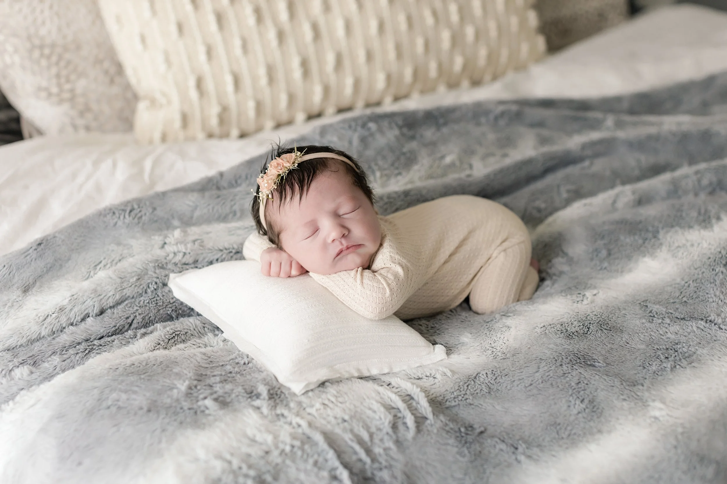 sleeping newborn wrapped in cream blanket during Savannah newborn photography session