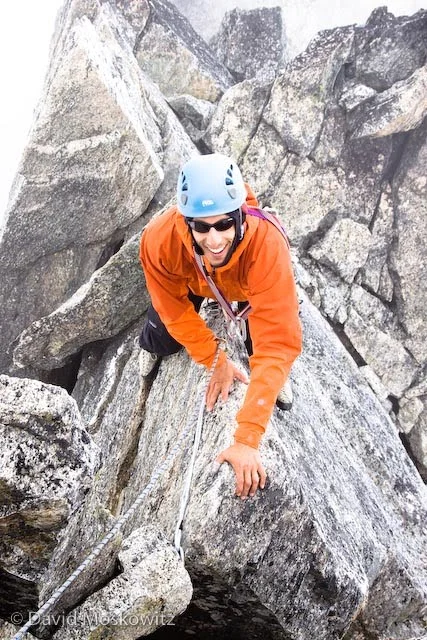 Matt navigating the final piece of the ridge, a knife edge section which he is climbing “au cheval”.