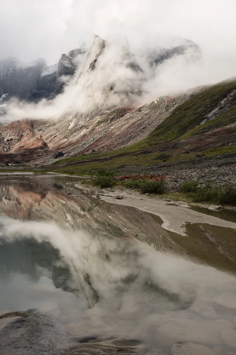 Mist clings to the Albatross and obscures Xanadu Peak and Melting Tower behind it at the headwaters of Arrigetch Creek, Brooks Range Alaska.
