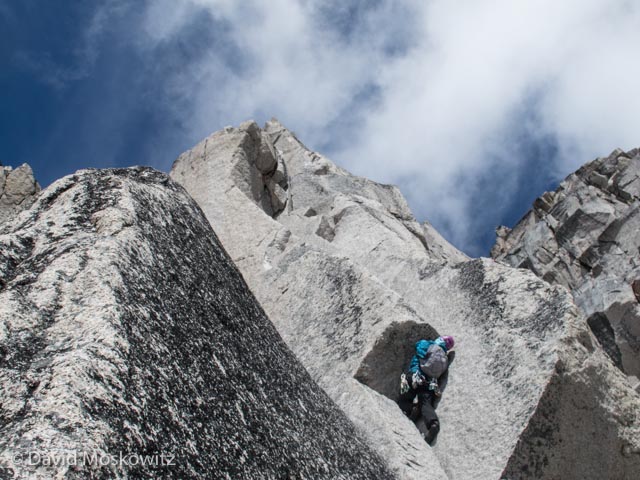 Erin Smart getting down to business on a roof on the forth pitch of the route (5.9).