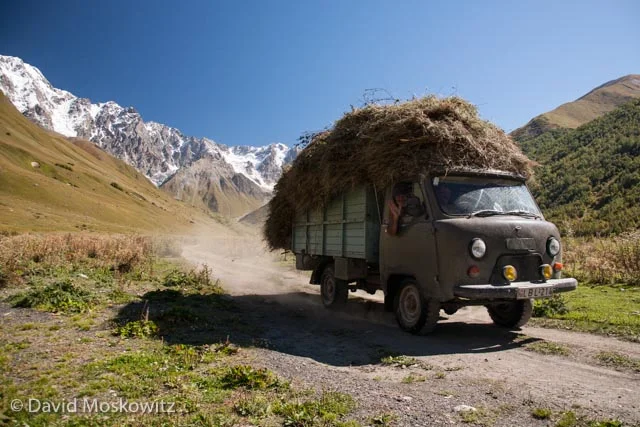 Hay being hauled out of the mountains to the village of Ushguli. Sveneti, Republic of Georgia.