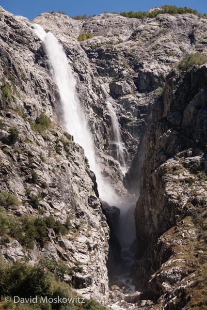 The massive bulk of Jhanga peak and Mount Shkhara from the west, drapped in ice and fresh snow, give birth to another tributary to the Inguri River. Sveneti Region, Republic of Georgia.
