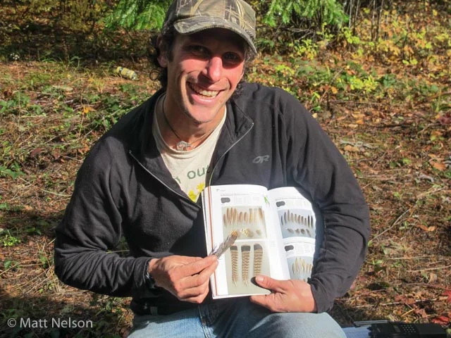 Matt Nelson photographed me leading a discussion on the identification of a collection of feathers from a Ruffed grouse found on the side of a forest road. David Scott (Track and Sign Specialist) and Casey McFarland (Specialist and Evaluator for Cybertracker Conservation) are the authors of the excellent resource pictured here, Bird Feathers: A Guide to North American Species.