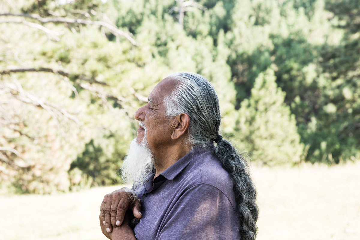 Lakota elder Cecil Cross leading participants of the gathering on a hike in the hills surrounding All Nations. During this break, he shared a few words and lots of passion and love for this land.