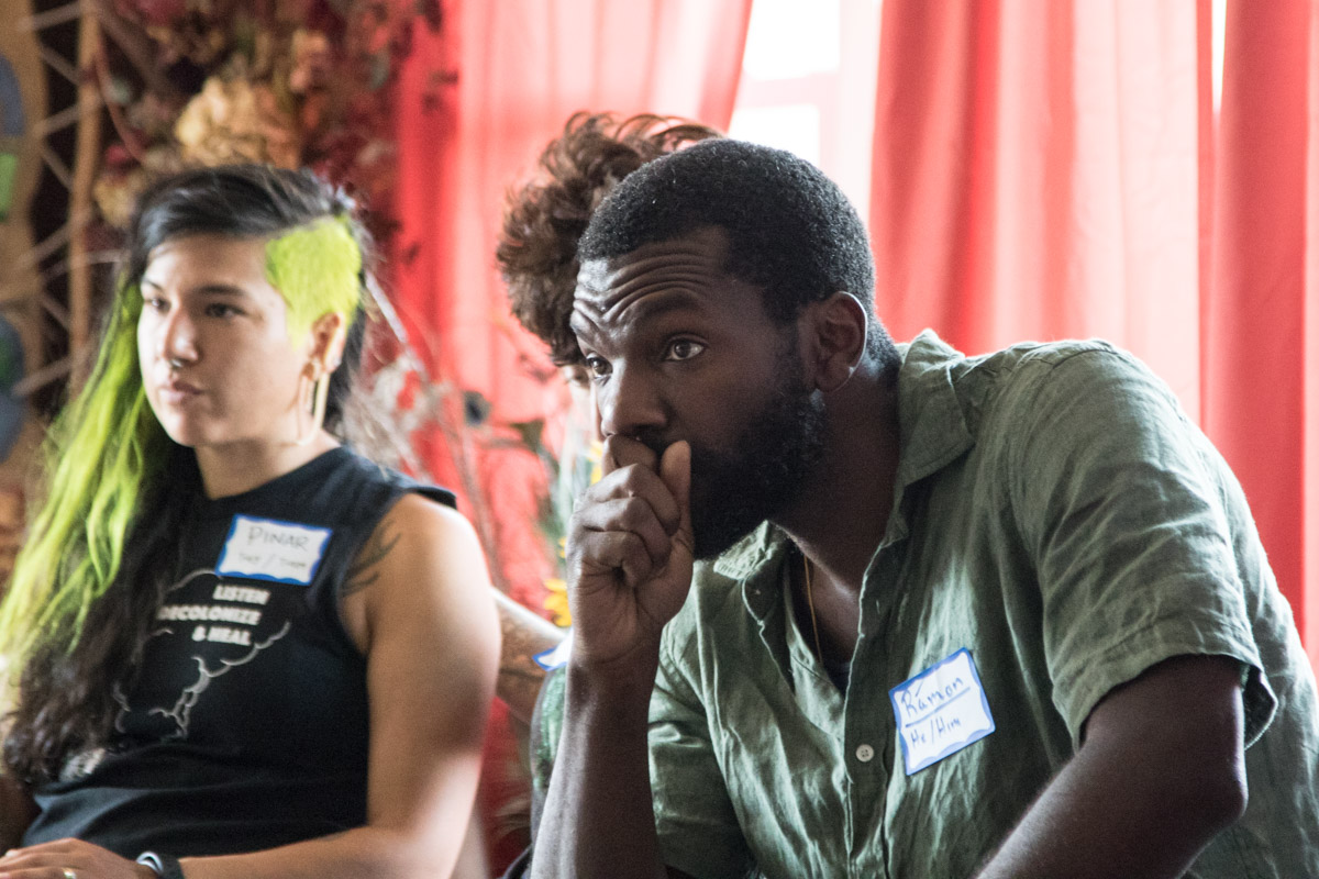 Ramon Parish, one of the facilitators for the gathering and a member of the Leadership Circle for Youth Passageways, listen intently during a talking circle..