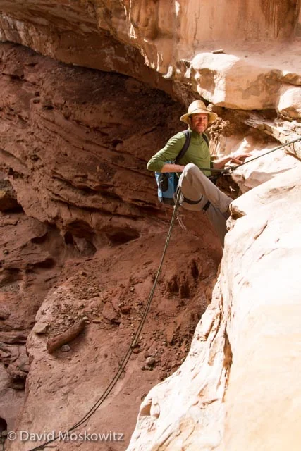 Ian Mallinson on one of the first rappells of the day which dropped over a series of undercut ledges before a free hanging section into a dry plung pool below.