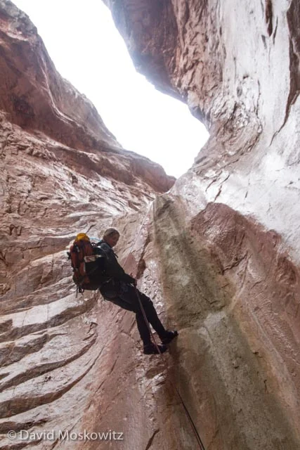 Stephanie Williams descending a step section of limestone. Cove Canyon, Arizona.