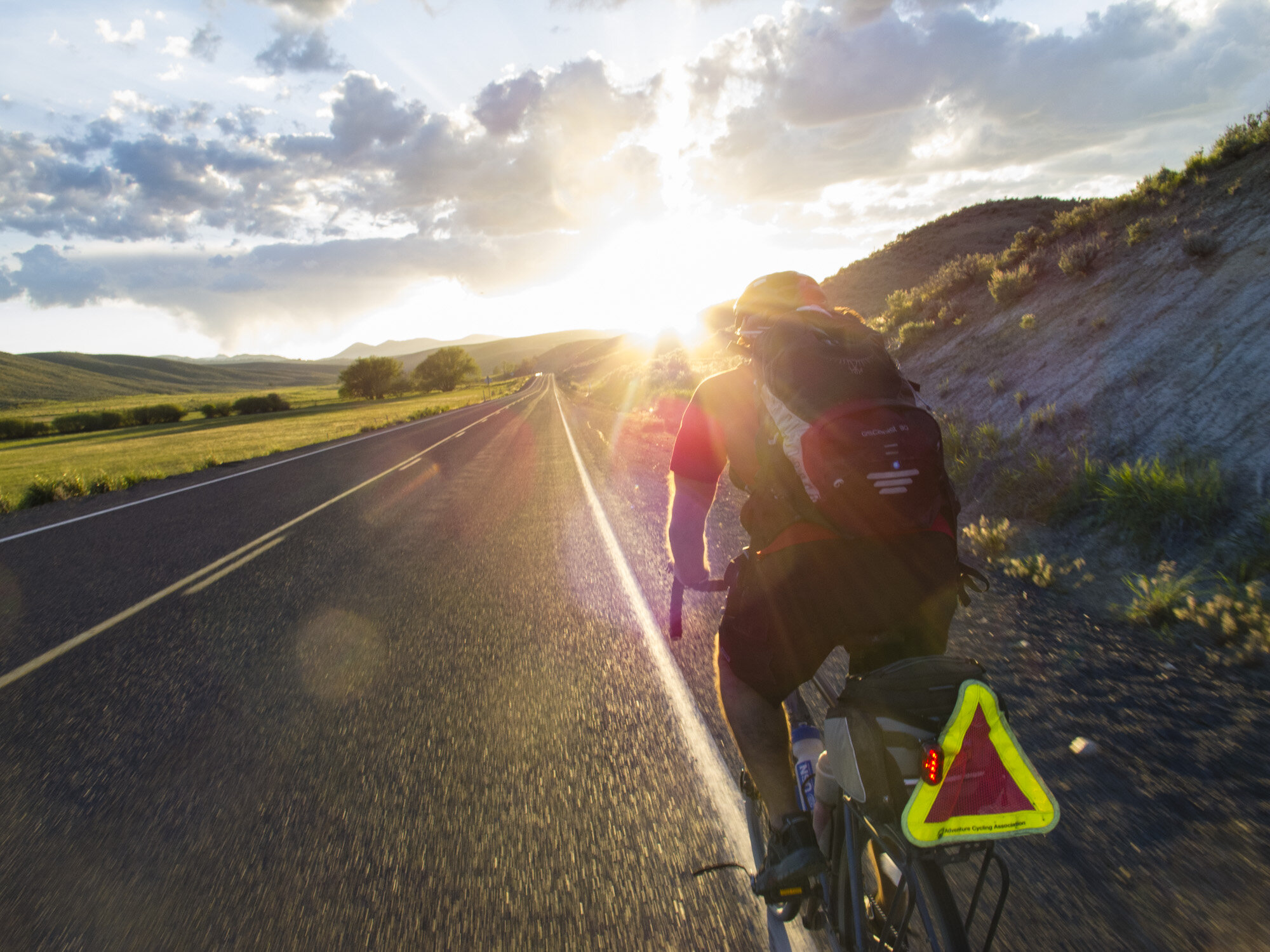  Galeo Saintz bikes towards the setting sun on a quite highway in northeastern Oregon. 