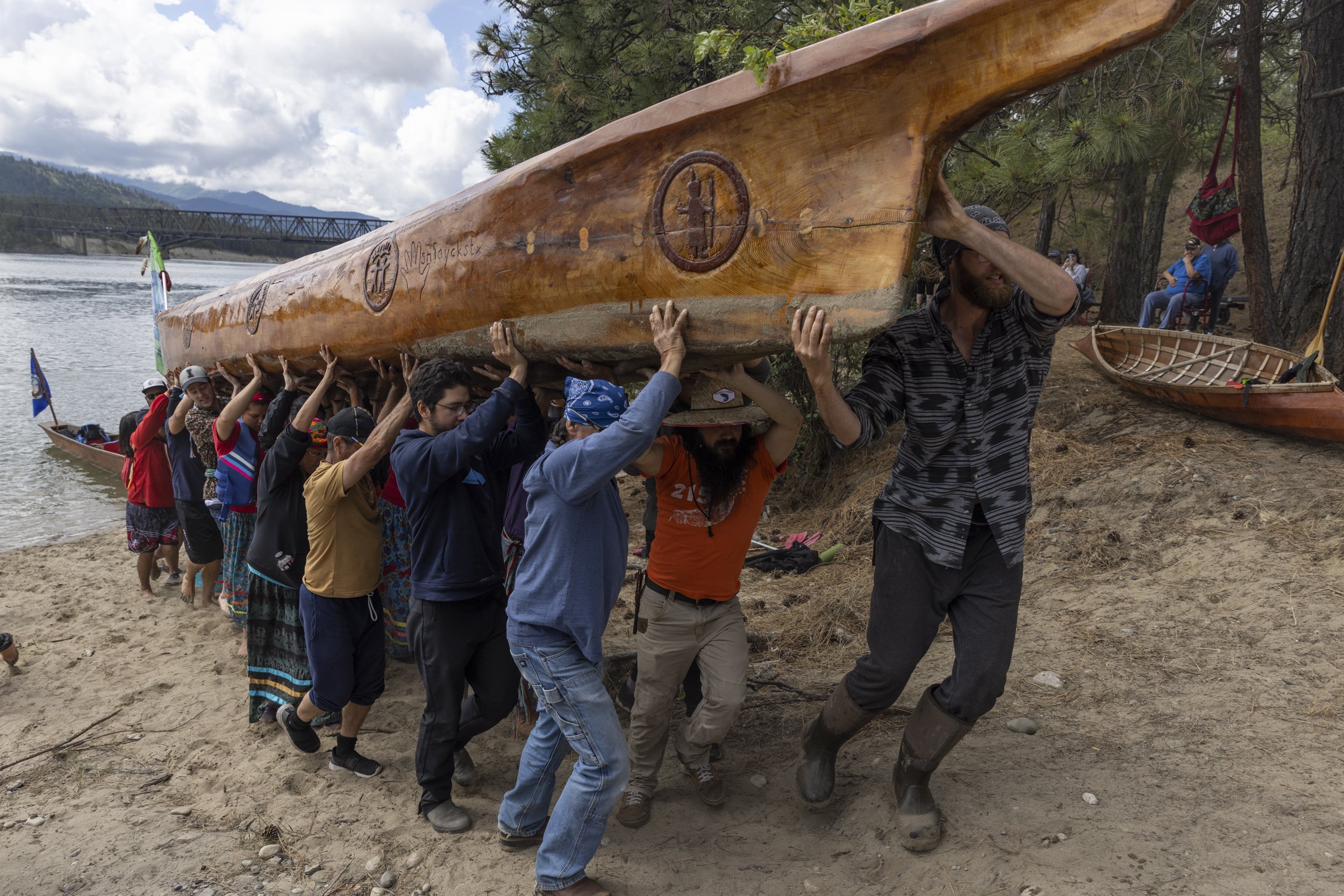  As a show of respect for the canoes, they are carefully lifted out of the water. This canoe is carved from an old growth cedar log. 