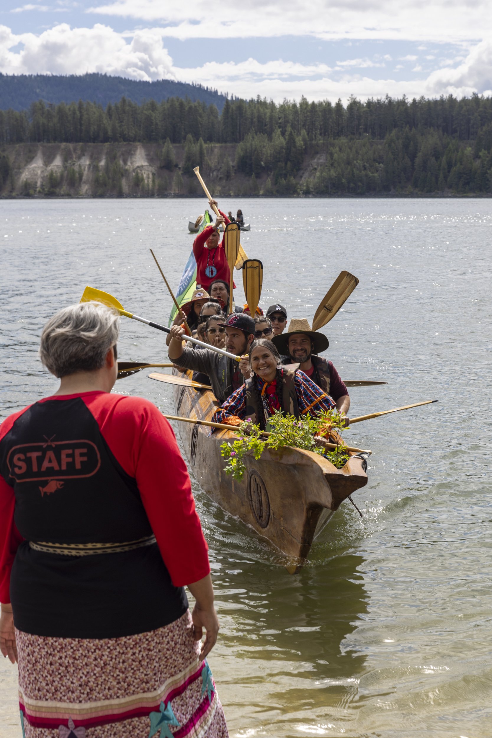  The Sinixt Canoe landing as part of the salmon ceremony at Kettle Falls with Shelly Boyd at the front of the canoe. 