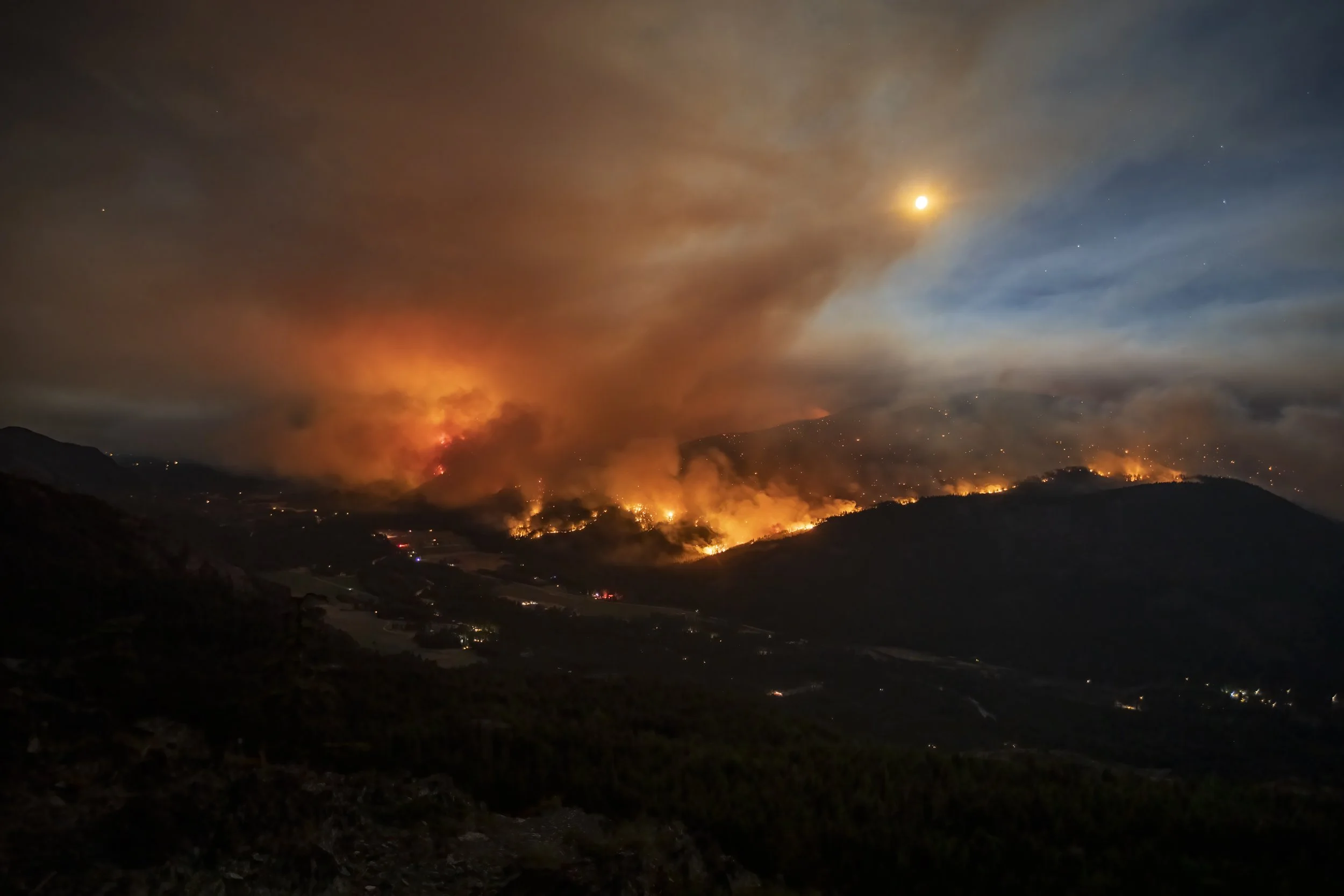 Wildfire and moonlight in the North Cascades.