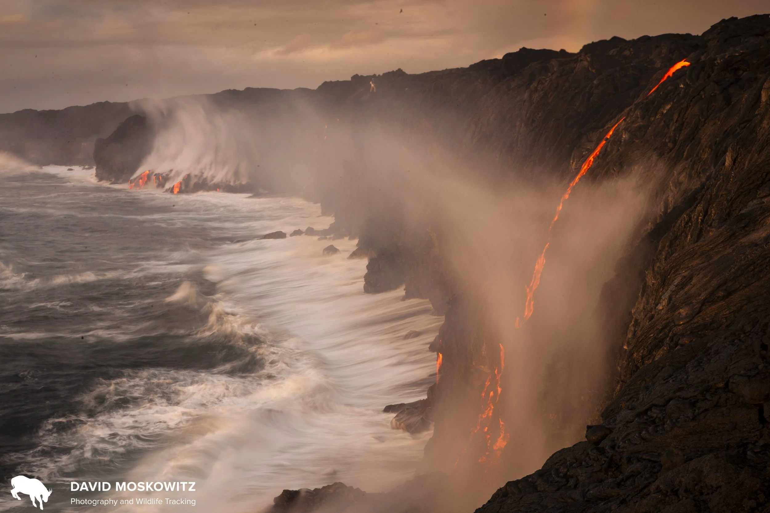 Lava from the Kilauea Volcano on the big isalnd of Hawaii pours over cliffs into the Pacific Ocean.