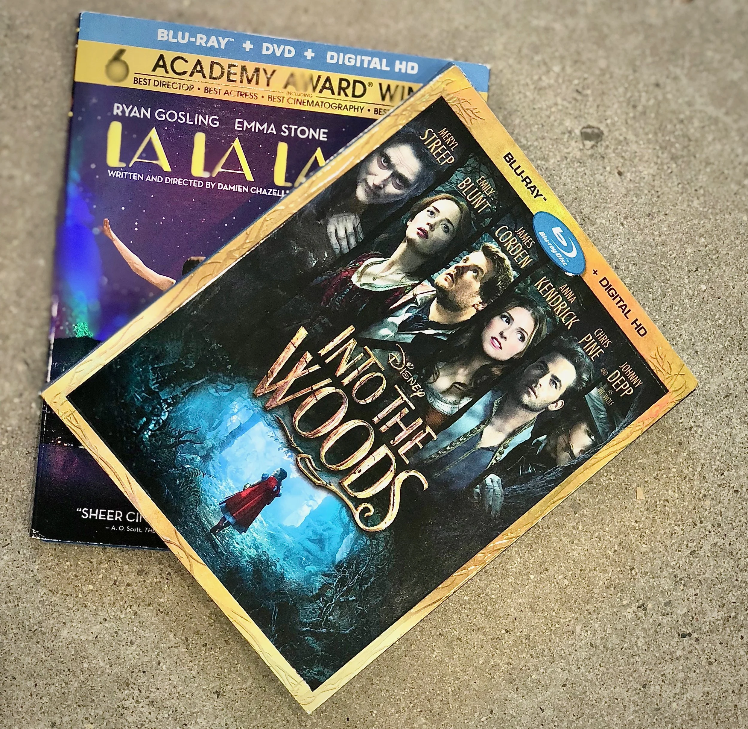 Win 1 copy of these hit musical movies on Blu-Ray. Disney's Into the Woods, and La La Land. 